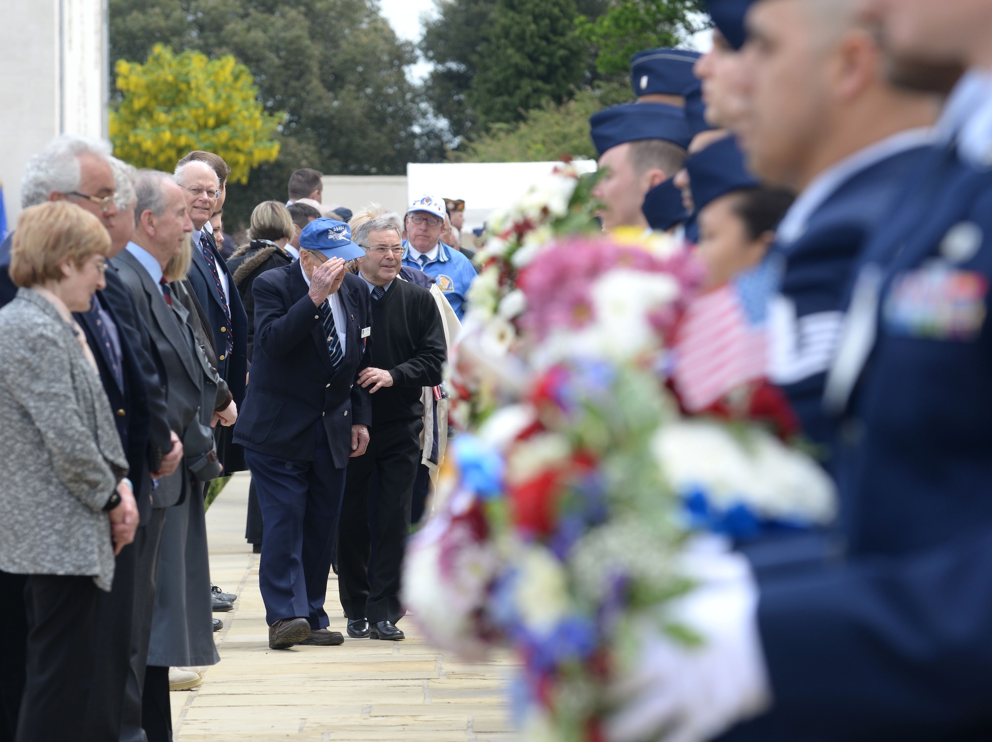 Designated wreath bearers move into position before receiving their respective wreaths during the annual Memorial Day observance at the Cambridge American Cemetery and Memorial May 25, 2015, in Cambridge, England. The memorial service was held in memory of more than 400,000 American World War II service members who paid the ultimate sacrifice to preserve freedom. (U.S. Air Force photo by Senior Airman Kate Thornton/Released)