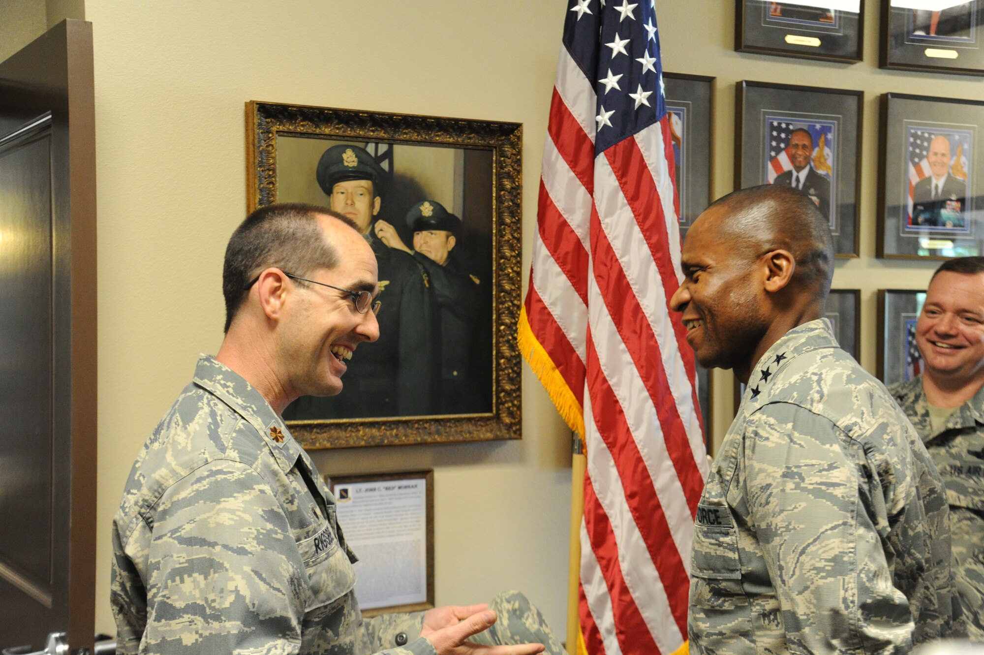 Gen. Darren McDew, Air Mobility Command commander, receives a brief about the Red Morgan Center from Maj. Daniel Rigsbee, 92nd Force Support Squadron commander, May 20, 2015, at Fairchild Air Force Base, Wash. Rigsbee told the story of Lt. Col. John “Red” Morgan, a Medal of Honor recipient, and how his actions impacted Fairchild Airmen. (U.S. Air Force photo/Airman 1st Class Nicolo J. Daniello)