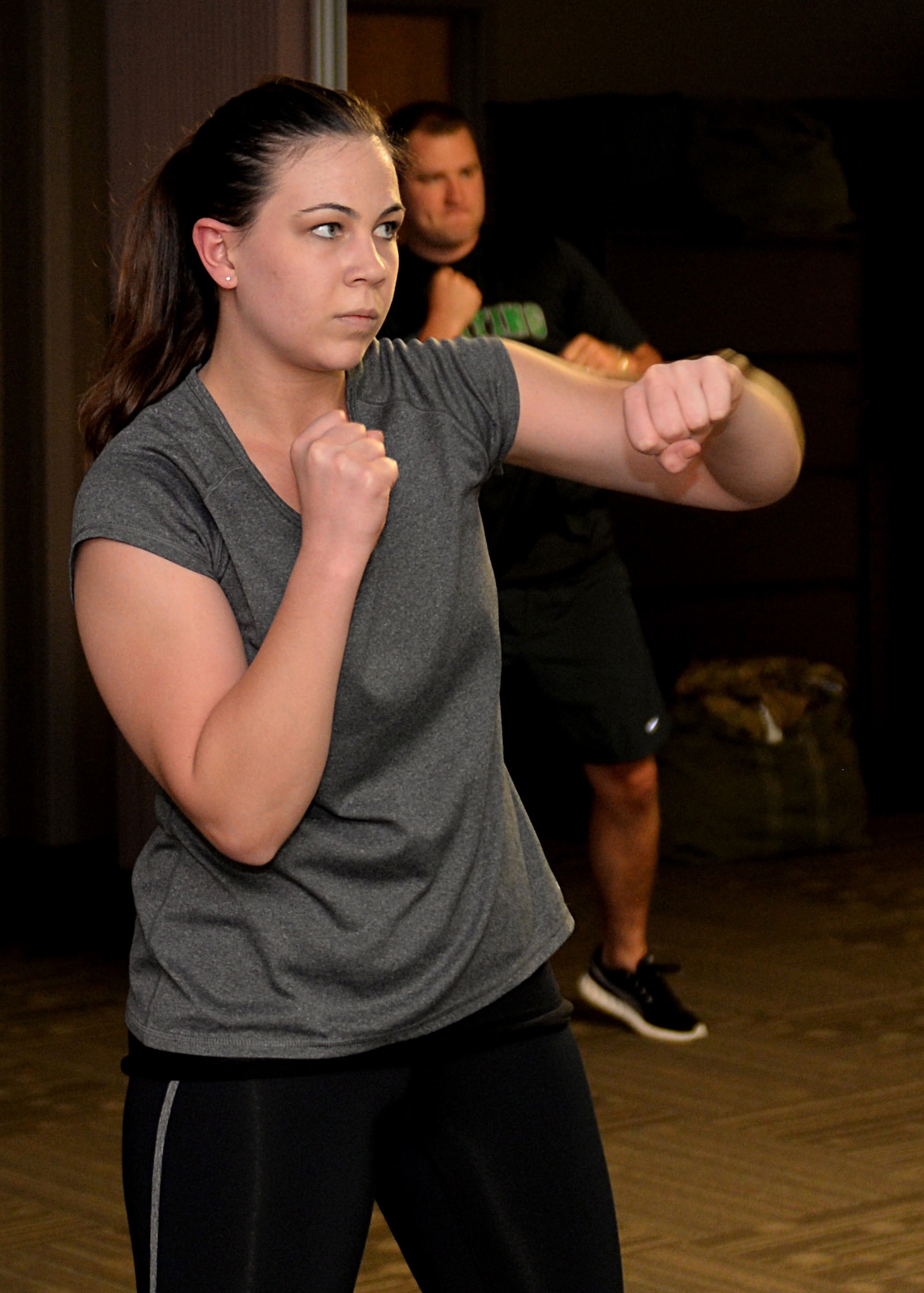 Senior Airman Morissa Martin, 28th Medical Operations Squadron aerospace medical technician, shadow boxes during her workout at Ellsworth Air Force Base, S.D., May 19, 2015. Each week, Martin participates in a high-intensity exercise program with her coworkers to achieve fitness goals. (U.S. Air Force photo by Airman 1st Class Rebecca Imwalle/Released)