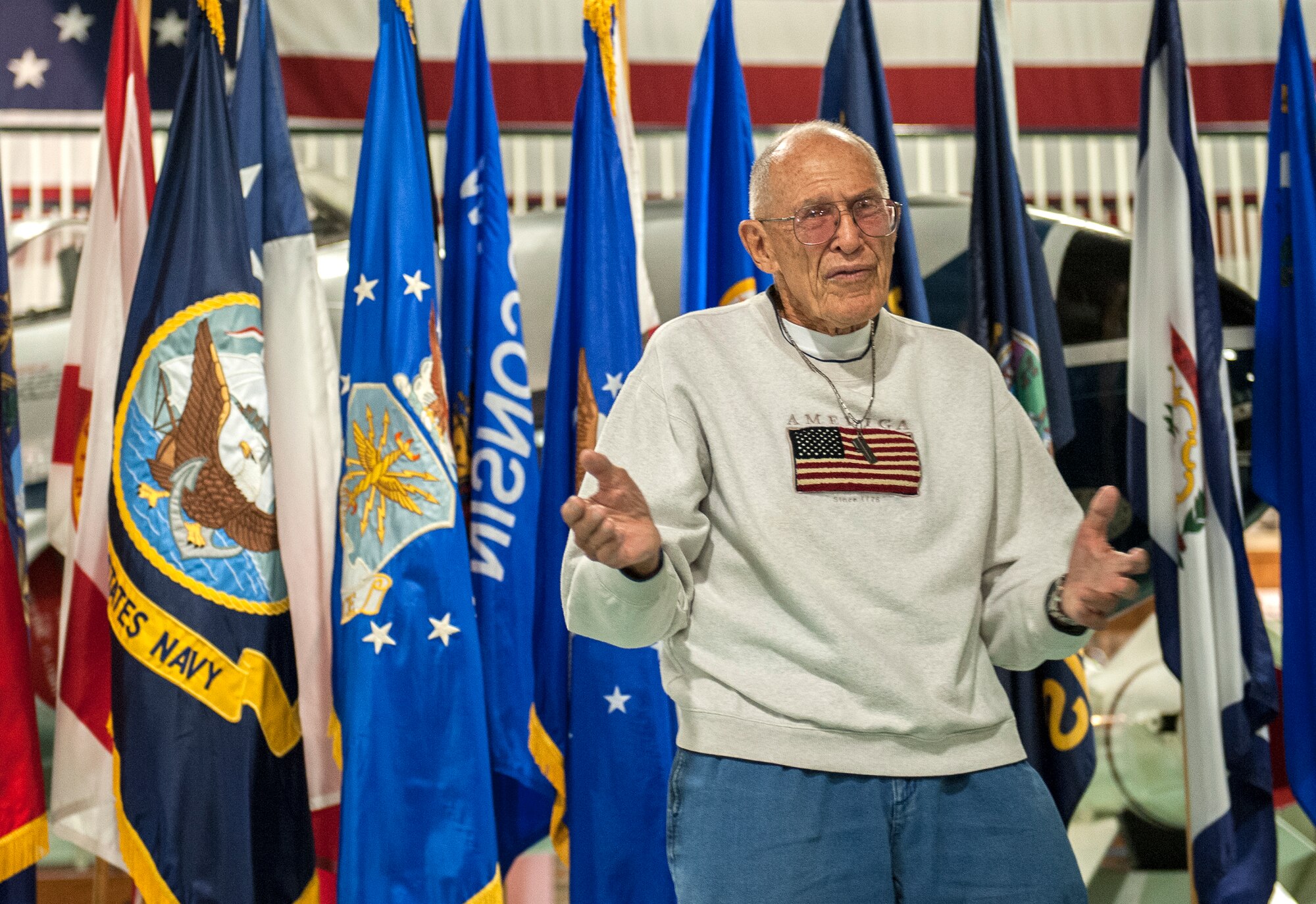Retired Army Command Sgt. Maj. Ted Arthurs addresses the audience at the Roll Call Memorial Service at the Air Force Armament Museum near Eglin Air Force Base, Fla., May 22.  The 86-year-old Korea and Vietnam War veteran shared stories of his time in combat and of the heroes living among us in the local community. The ceremony paid respect to 550 fallen Florida service members who died in the service of their country during conflicts ranging from World War II to the present. The event included the posting of the colors by Eglin’s Honor Guard, the reading of a congressional letter of appreciation and the recital of each name of the fallen. (U.S. Air Force photo/Ilka Cole)