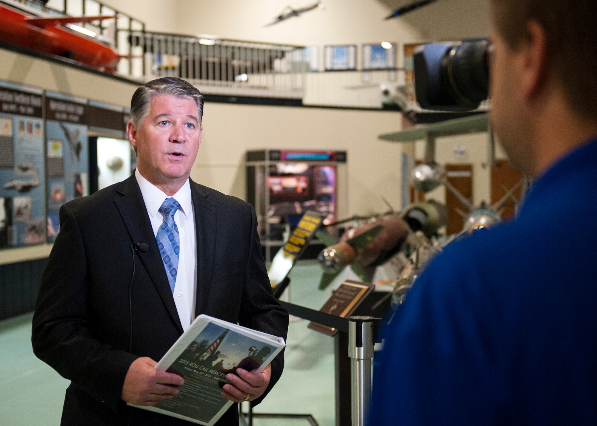Dr. John Wilcox, Director of the Air Force Research Laboratory’s Munitions Directorate, speaks to local media before the Roll Call Memorial Service at the Air Force Armament Museum near Eglin Air Force Base, Fla., May 22.  The ceremony paid respect to 550 fallen Florida service members who died in the service of their country during conflicts ranging from World War II to the present. The event included the posting of the colors by Eglin’s Honor Guard, the reading of a congressional letter of appreciation and the recital of each name of the fallen. (U.S. Air Force photo/Ilka Cole) 