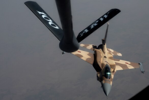 A Royal Moroccan air force F-16 Fighting Falcon releases after receiving fuel from a KC-135 Stratotanker assigned to RAF Mildenhall, England, while participating in Exercise African Lion May 18, 2015. The exercise features first-time integrated flying operations training and is the largest Department of Defense exercise in Africa (U.S. Air Force photo by Senior Airman Victoria H. Taylor/Released)