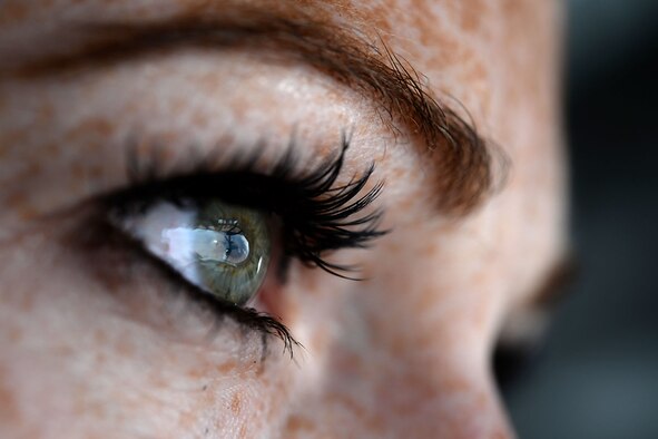 The reflection of an F-16 Fighting Falcon from Spangdahlem Air Base, Germany, appears in the eye of U.S. Air Force Senior Airman Amy Lizauckas, 351st Air Refueling Squadron boom operator from Buffalo, N.Y., during Exercise African Lion May 21, 2015. The annual exercise between the U.S. and the Kingdom of Morocco involves more than 2,500 personnel training to improve interoperability and mutual understanding of each nation's tactics, techniques and procedures. (U.S. Air Force photo by Senior Airman Kate Thornton/Released)