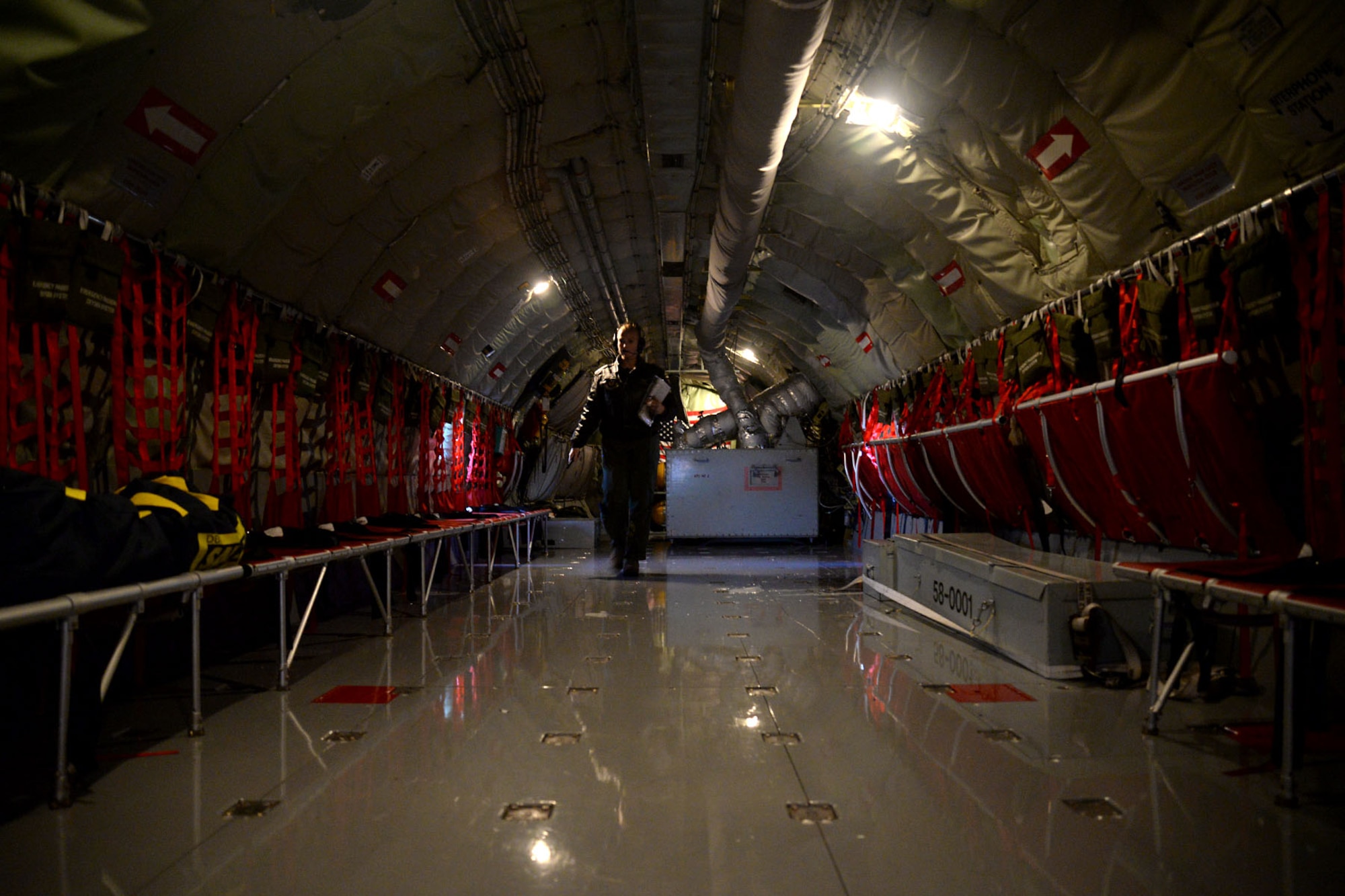 U.S. Air Force Senior Airman Amy Lizauckas, 351st Air Refueling Squadron boom operator from Buffalo, N.Y., returns to a KC-135 Stratotanker flight deck May 21, 2015, after a preflight inspection on RAF Mildenhall, England. The crew is supporting Exercise African Lion, a U.S. Marine Corps-led exercise that encompasses more than six different nations working together to enhance interoperability. (U.S. Air Force photo by Senior Airman Kate Thornton/Released)