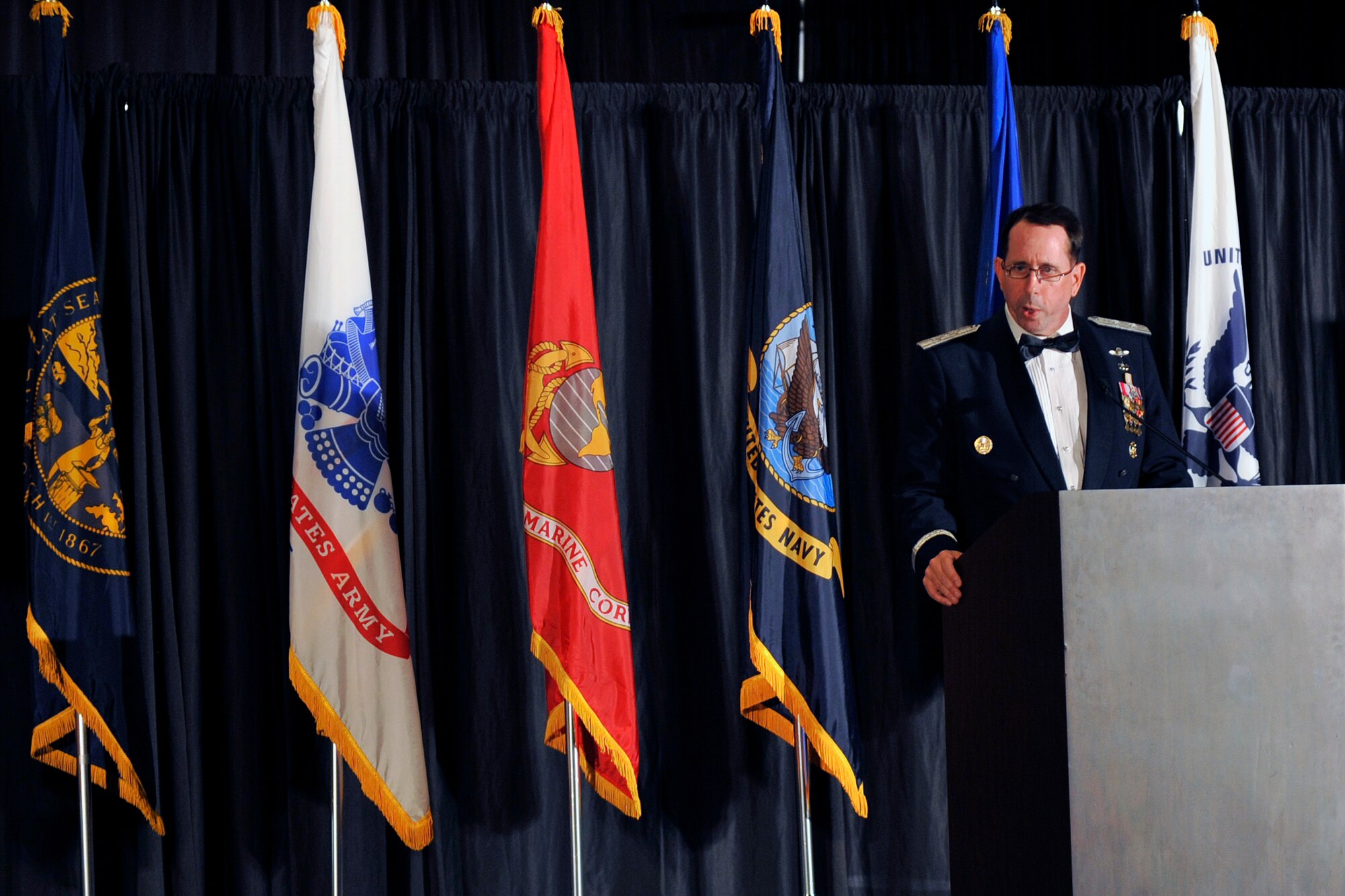 U.S. Air Force Maj. Gen. John N. T. Shanahan, Twenty-Fifth Air Force commander and guest speaker for the 2015 55th Wing Birthday Ball, speaks to patrons at the Embassy Suites ballroom in La Vista, Nebraska, May 16. The birthday ball is a formal celebration recognizing the wing’s proud heritage as well as its current mission and role in the U.S. Air Force. (U.S. Air Force photo by Jeff W. Gates/Released)