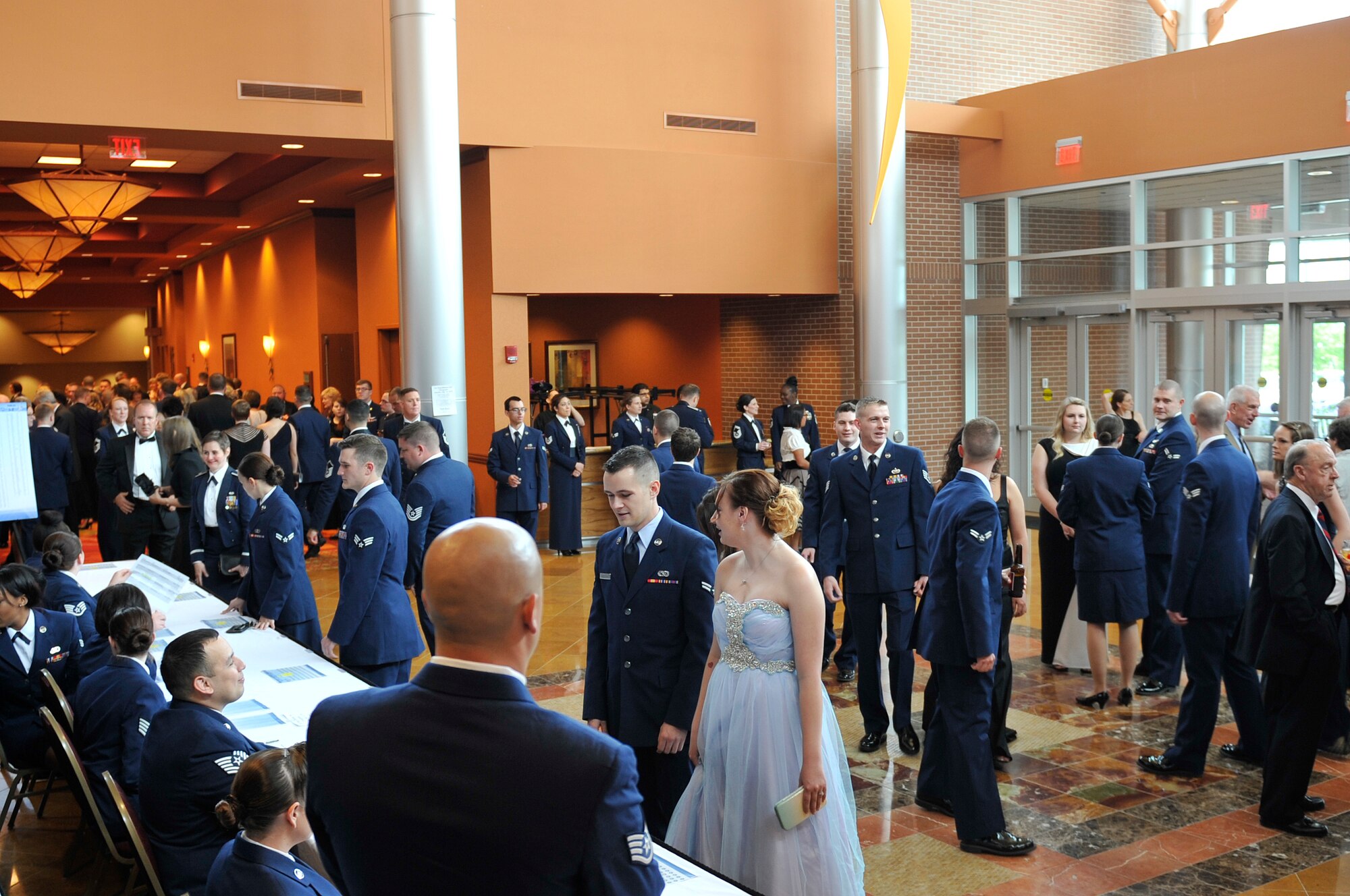 Patrons arrive inside the Embassy Suites in La Vista, Nebraska for the 2015 55th Wing Birthday Ball, May 16. The birthday ball is a formal celebration recognizing the wing’s proud heritage as well as its current mission and role in the U.S. Air Force. (U.S. Air Force photo by Jeff W. Gates/Released)
