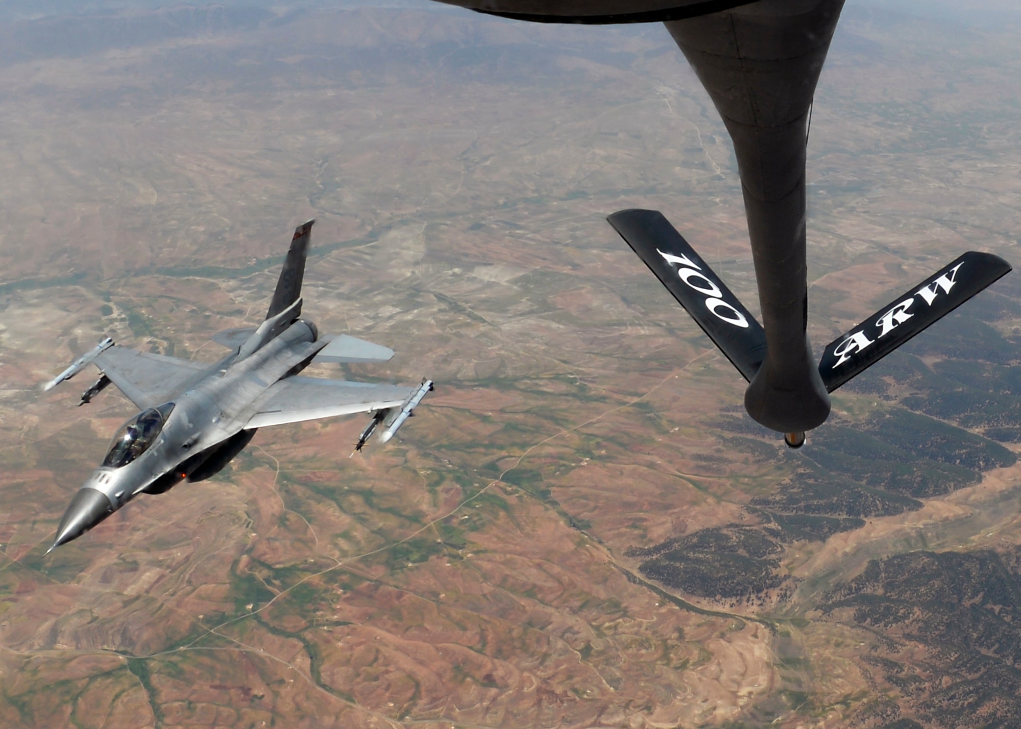 An F-16 Fighting Falcon from Spangdahlem Air Base, Germany, releases after receiving fuel from a KC-135 Stratotanker assigned to RAF Mildenhall, England, while participating in Exercise African Lion May 15, 2015. The U.S. Marine Corps-led exercise encompasses more than six different nations working together to enhance interoperability. (U.S. Air Force photo by Senior Airman Victoria H. Taylor/Released)