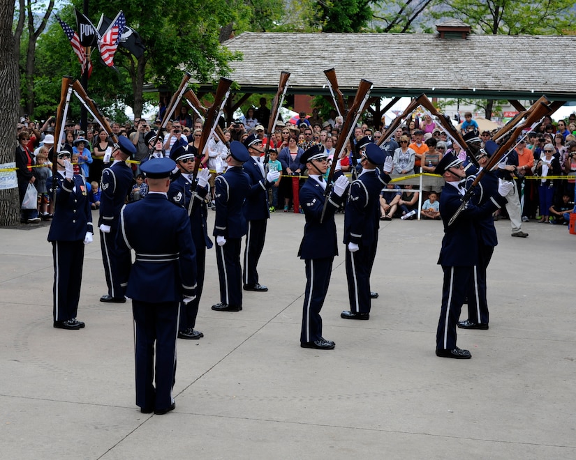The U.S. Air Force Honor Guard Drill Team performs during the 40th Annual Territory Days, a weekend-long street festival leading up to a remembrance ceremony on Memorial Day, May 25, 2015, in Colorado Springs, Colo. The Drill Team promotes the Air Force mission by showcasing drill performances at public and military venues to recruit, retain and inspire Airmen. (U.S. Air Force photo by Senior Airman Preston Webb/Released)