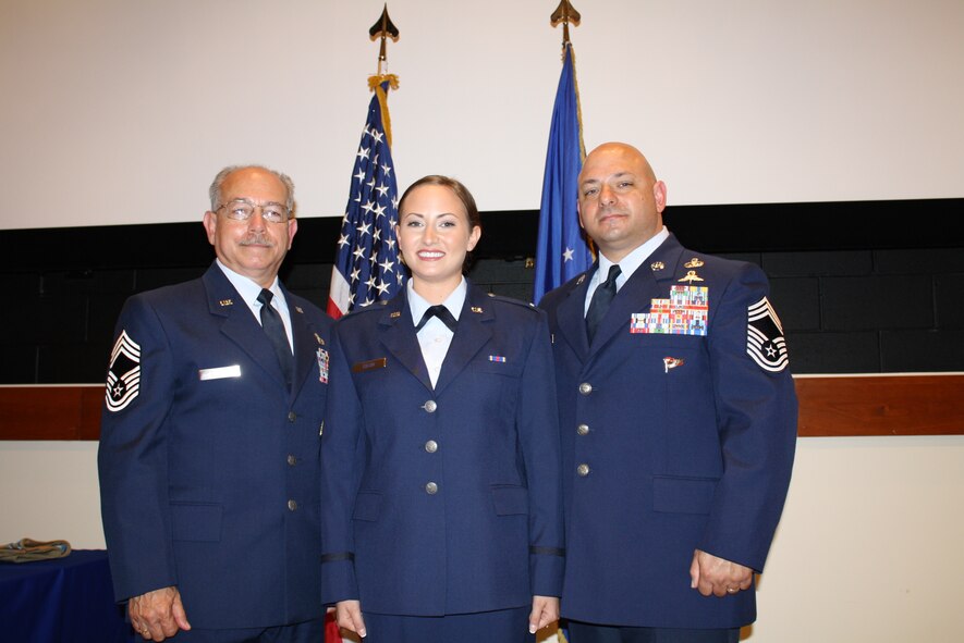 2nd Lt. Jenna Colon poses for a photo with her family after her commissioning ceremony at East Carolina University, May 9, 2015. 2nd Lt. Colon is continuing a family tradition of military service that stretches back to the Korean War and received her first salute from her father. (Courtesy photo)