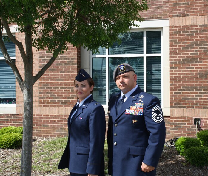 Chief Master Sgt. Jason Colon, 91st Operations Group superintendent, poses for a photo with his daughter Jenna Colon at East Carolina University, May 9, 2015. 2nd Lt. Colon is continuing a family tradition of military service that stretches back to the Korean War. (Courtesy photo)