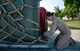 U.S. Air Force Senior Airman Danielle Repp, 351st Air Refueling Squadron boom operator from Spokane, Wash., secures cargo to a shipping pallet May 11, 2015, at Moron Air Base, Spain. Airmen from the 100th Air Refueling Wing began deployment rotations to Moron AB in January 2013 until May 2015 in support of operations in Mali. (U.S. Air Force photo by Senior Airman Christine Halan/Released)