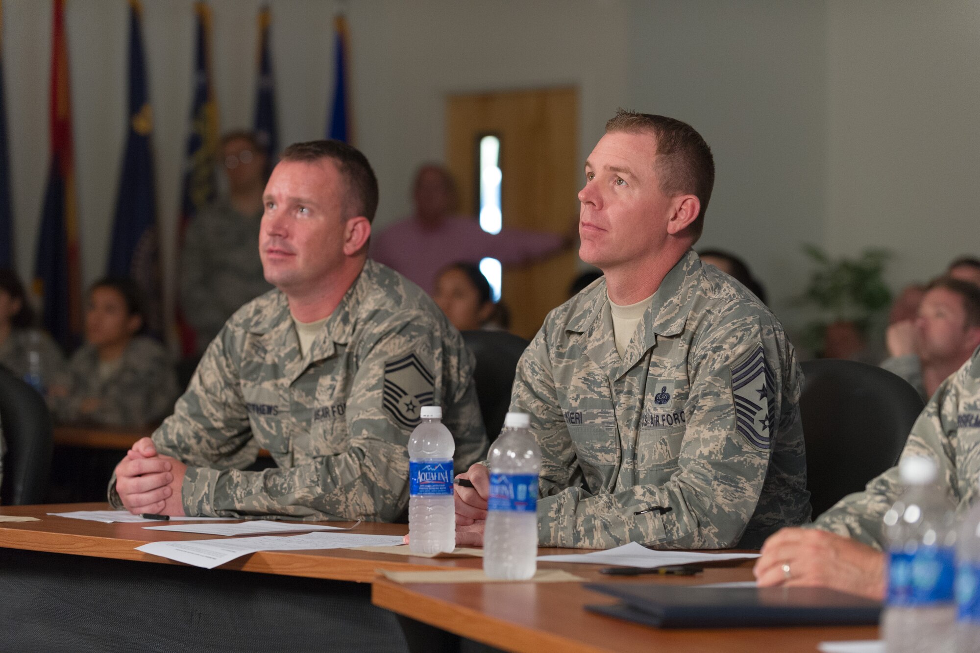 Senior Master Sgt. Clifton Matthews, 45th Force Support Squadron Readiness NCO and superintendent (left), and Chief Master Sgt. Craig Neri, 45th SW command chief, (right), along with members of Team-Patrick Cape participate in a Google Hang Out hosted by Air Force Chief of Staff Gen. Mark A. Welsh III, for his second Google Hangout, May 21, 2015, at the Professional Development Center at Patrick Air Force Base, Fla. The hangout gave Airmen, from six bases, an opportunity to join Air Force Chief of Staff for a discussion about today’s Air Force. The discussion was open for anyone wanting to watch. (U.S. Air Force photo/Cory Long) (Released) 
