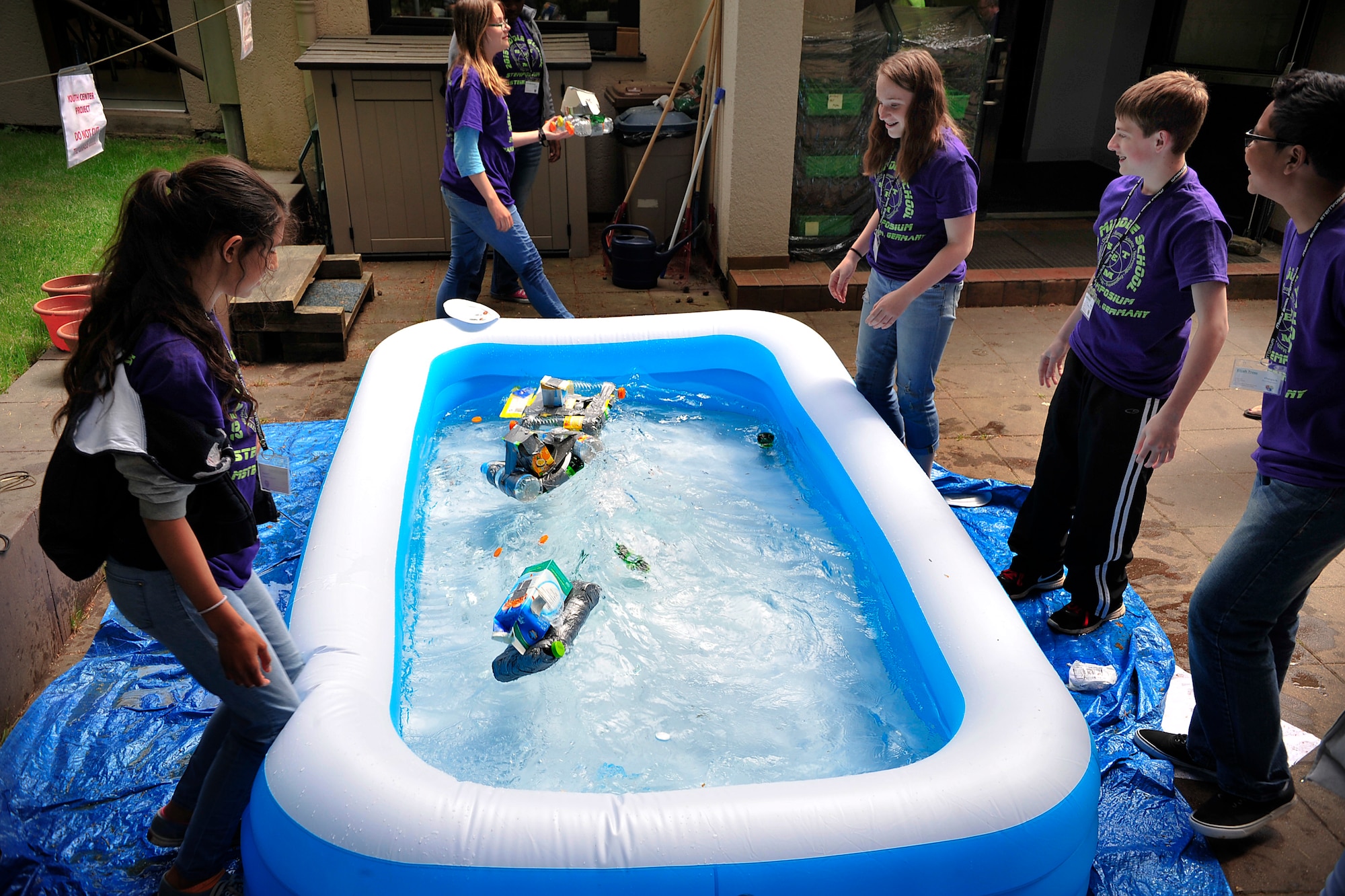 Middle school students test their hand-crafted boats during a STEMposium challenge May 13, 2015, at Ramstein Air Base, Germany. Students from all around Germany were tested on their science, technology, engineering and math skills in different challenges. (U.S. Air Force photo/Airman 1st Class Larissa Greatwood)