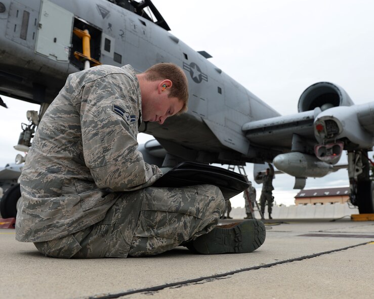 A U.S. Air Force crew chief from the 354th Expeditionary Fighter Squadron fills out paper work during a theater security package deployment at Sliac Air Base, Slovakia, May 22, 2015. More than 40 Airmen from the 354th EFS deployed to Slovakia to participate in a theater security package in support of Operation Atlantic Resolve. (U.S. Air Force photo by Senior Airman Dylan Nuckolls/Released)