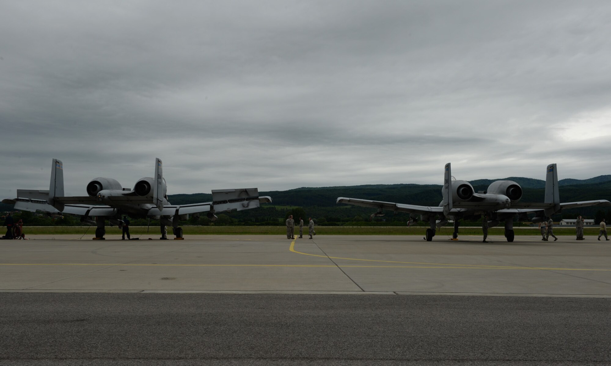 Two U.S. Air Force A-10 Thunderbolt II attack aircraft assigned to the 354th Expeditionary Fighter Squadron sit on the apron during a theater security package deployment at Sliac Air Base, Slovakia, May 22, 2015. The U.S. values the shared commitment and close cooperation with NATO partners on the security and stability of Europe. (U.S. Air Force photo by Senior Airman Dylan Nuckolls/Released)