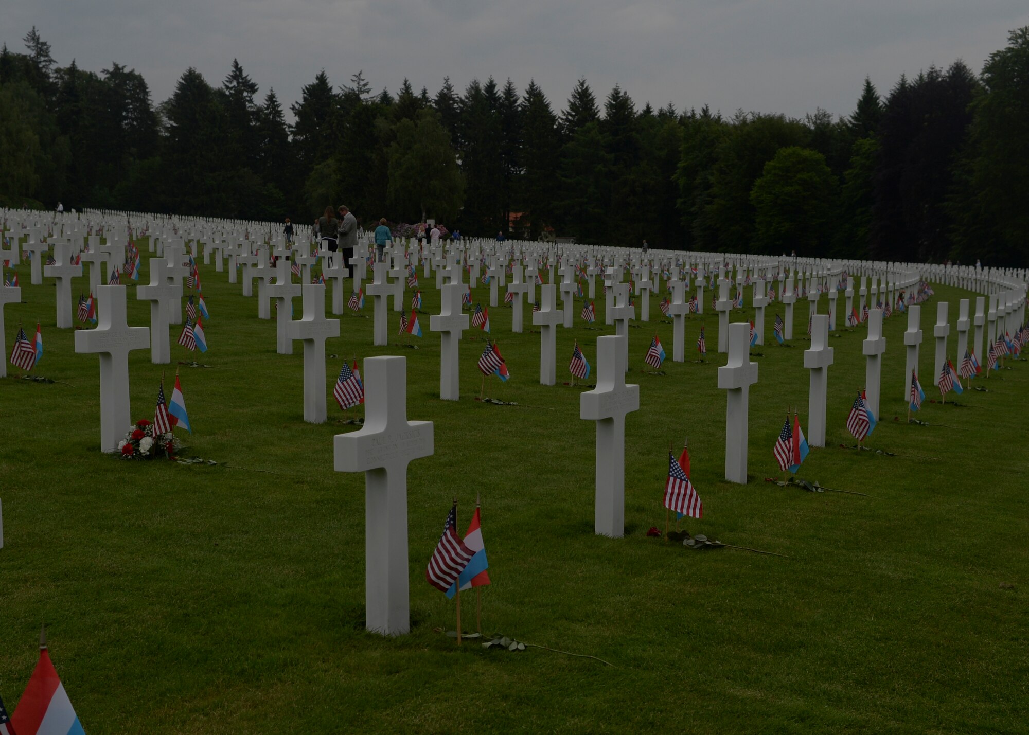 A row of memorial graves remain decorated with U.S. and Luxembourg flags after a Memorial Day ceremony at the Luxembourg American Cemetery and Memorial in Luxembourg, May 23, 2015. More than 300 Luxembourgers and Americans gathered at the cemetery to reflect on the sacrifices made by fallen U.S. service members. (U.S. Air Force photo by Staff Sgt. Joe W. McFadden/Released)  