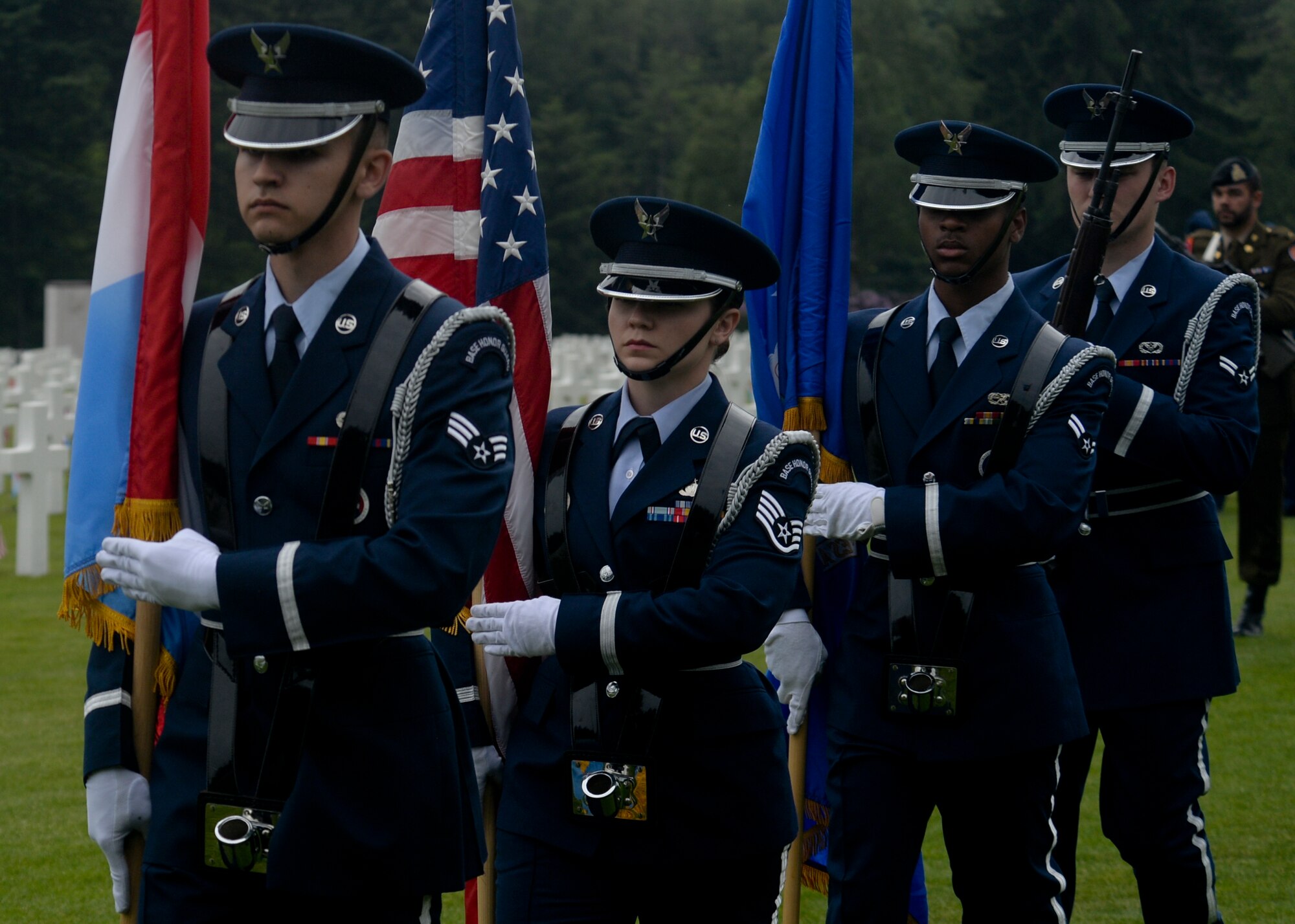 U.S. Air Force ceremonial guardsmen from Spangdahlem Air Base, Germany, carry the colors at the conclusion of a Memorial Day ceremony at the Luxembourg American Cemetery and Memorial in Luxembourg, May 23, 2015. Memorial Day is observed on the last Monday of May in remembrance of those who gave the ultimate sacrifice and has origins beginning with the memorial observances for the Civil War. (U.S. Air Force photo by Staff Sgt. Joe W. McFadden/Released)  