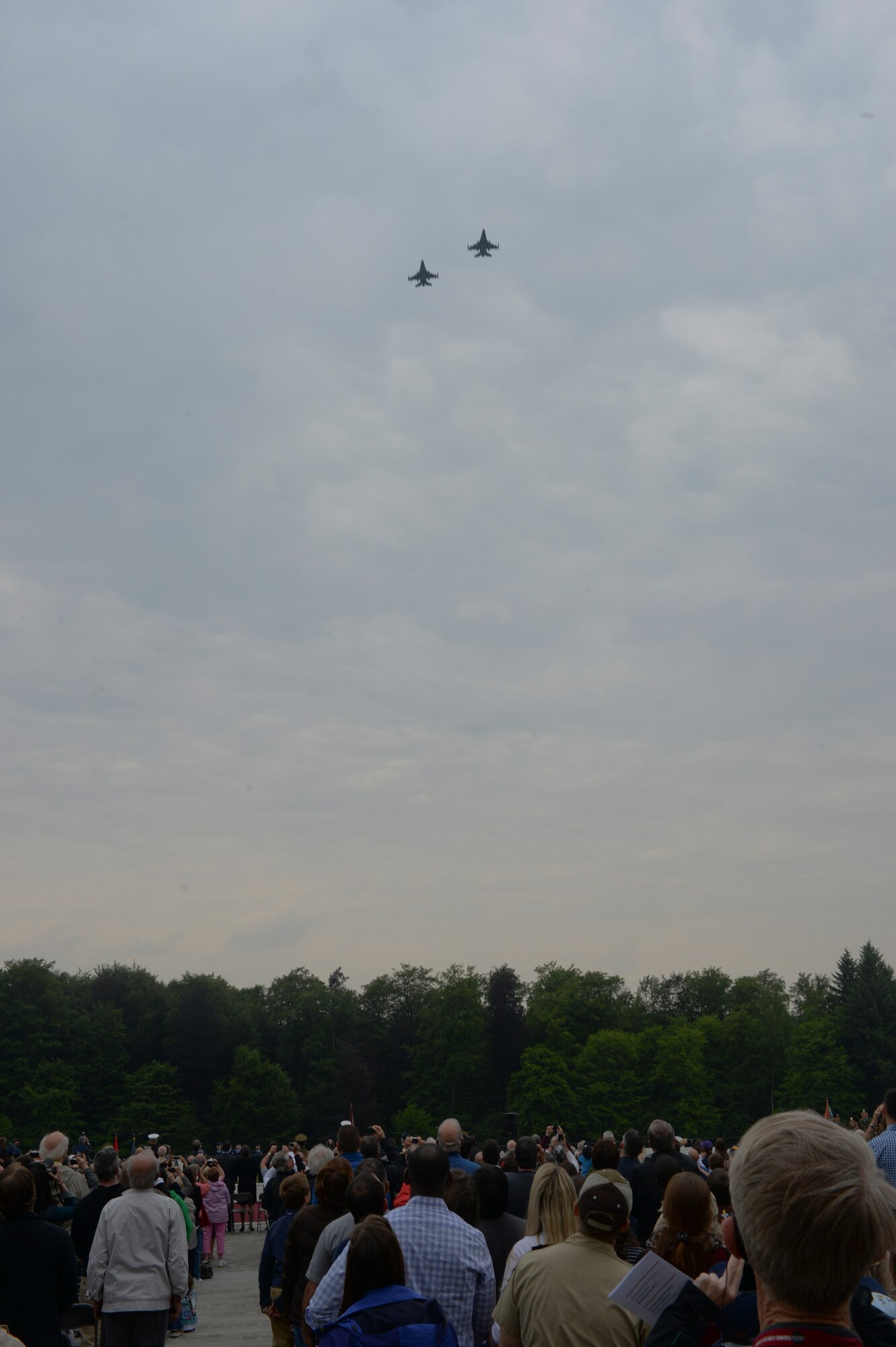 Two U.S. Air Force F-16 Fighting Falcon fighter aircraft assigned to the 480th Fighter Squadron at Spangdahlem Air Base, Germany, fly over the Luxembourg American Cemetery and Memorial in Luxembourg, during a Memorial Day ceremony May 23, 2015. Memorial Day is observed on the last Monday of May in remembrance of those who gave the ultimate sacrifice and has origins beginning with the memorial observances for the Civil War. (U.S. Air Force photo by Staff Sgt. Joe W. McFadden/Released)  