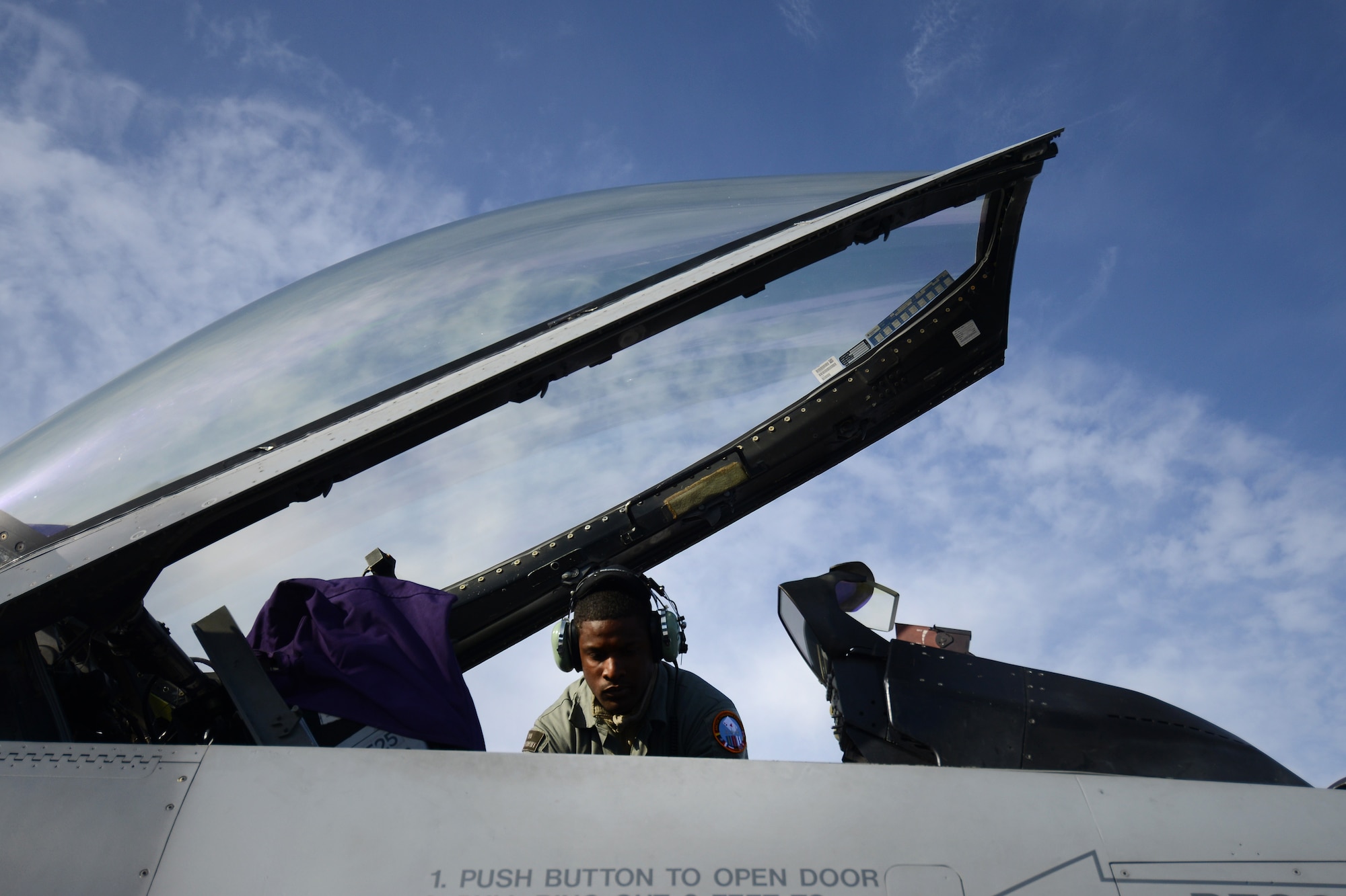 U.S. Air Force Airman 1st Class Keitha Whitaker Jr., 31st Aircraft Maintenance Squadron crew chief prepares an F-16 Fighting Falcon from Aviano Air Base, Italy, for takeoff at Kallax Air Base, Sweden, May 25, 2015, during Arctic Challenge Exercise 2015. Throughout the duration of the exercise, U.S., NATO and Partners for Peace militaries will work in a joint environment to deliver unified responses for simulated contingencies. ACE 15 is scheduled to continue until June 5, before concluding with its final air operations. (U.S. Air Force photo by Staff Sgt. Evelyn Chavez)  