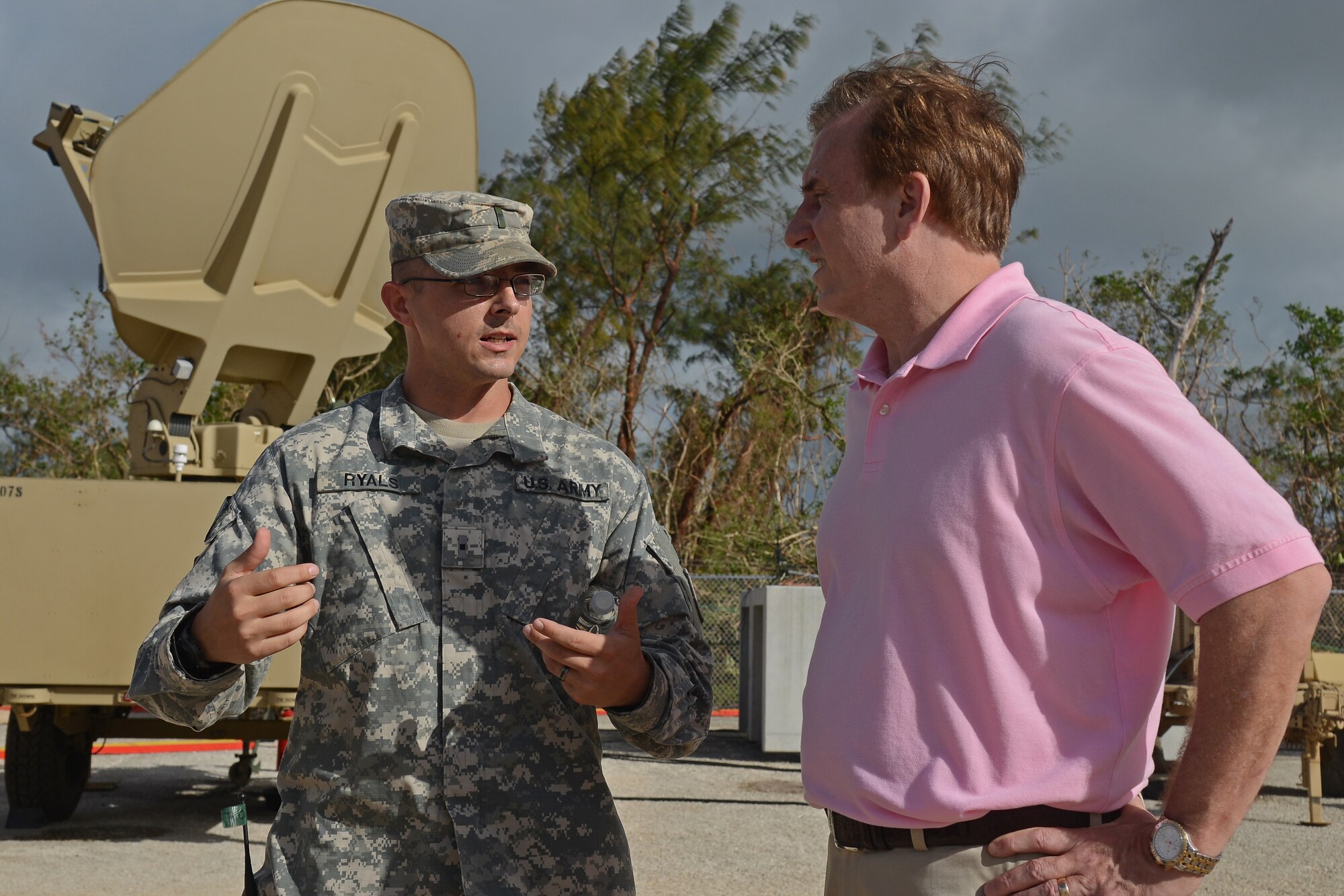 U.S. Army Warrant Officer David Ryals explains to Rep. John Fleming, a member of the House Armed Services Committee, the basic layout of the Terminal High Altitude Area Defense site, May 24, 2015, at Andersen Air Force Base, Guam. A group of Congressional delegates visited the base to gain a better understanding of current operations in the region. (U.S. Air Force photo by Senior Airman Alexander W. Riedel/Released)