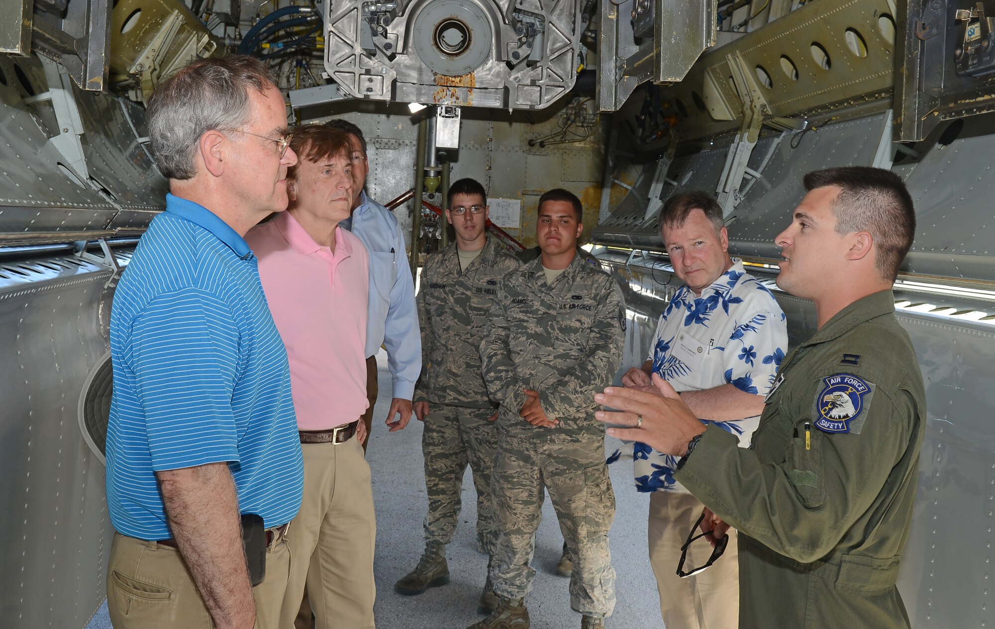 Capt. Alexander Barwikowski (right), B-52 Stratofortress weapons system officer with the 20th Expeditionary Bomb Squadron, guides representatives with the House Armed Services Committee during a tour of the aircraft’s bomb bay, May 24, 2015, at Andersen Air Force Base, Guam. Congress members visited the bases to gain a better understanding of current rebalance efforts in the Pacific region. (U.S. Air Force photo by Senior Airman Alexander W. Riedel/Released)