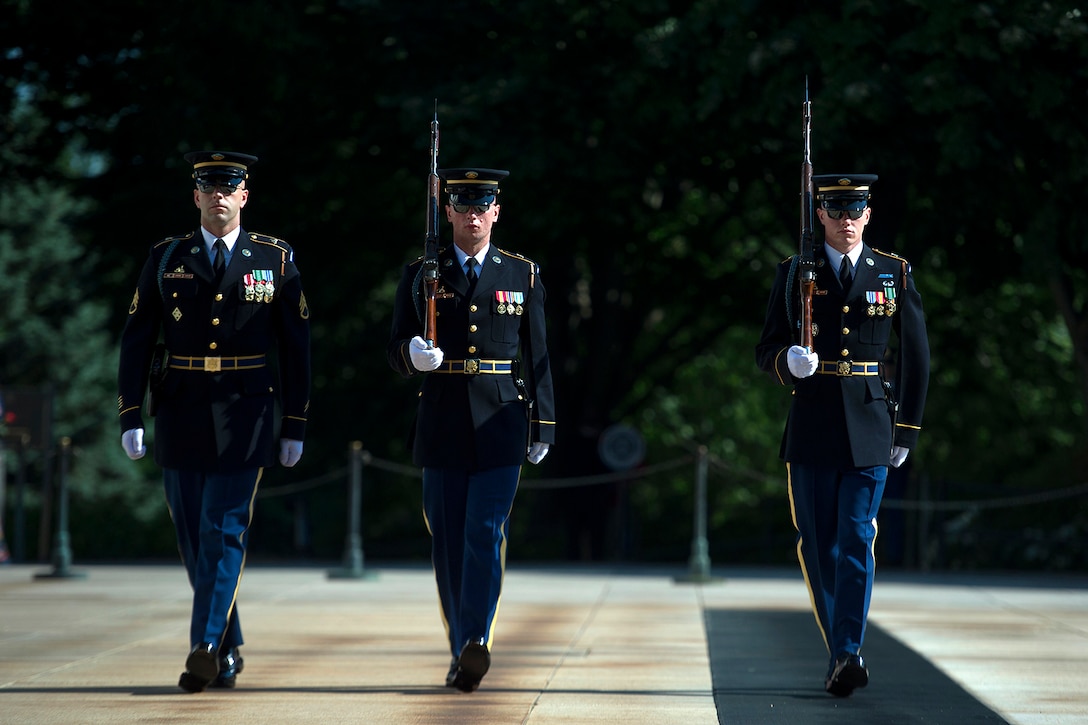 Army Honor Guard soldiers, 3rd U.S. Infantry Regiment, known as "The Old Guard.", perform the Changing of the Guard at the Tomb of the Unknown Soldier before participating in a Memorial Day ceremony at Arlington National Cemetery in Arlington, Va., May 25, 2015. 