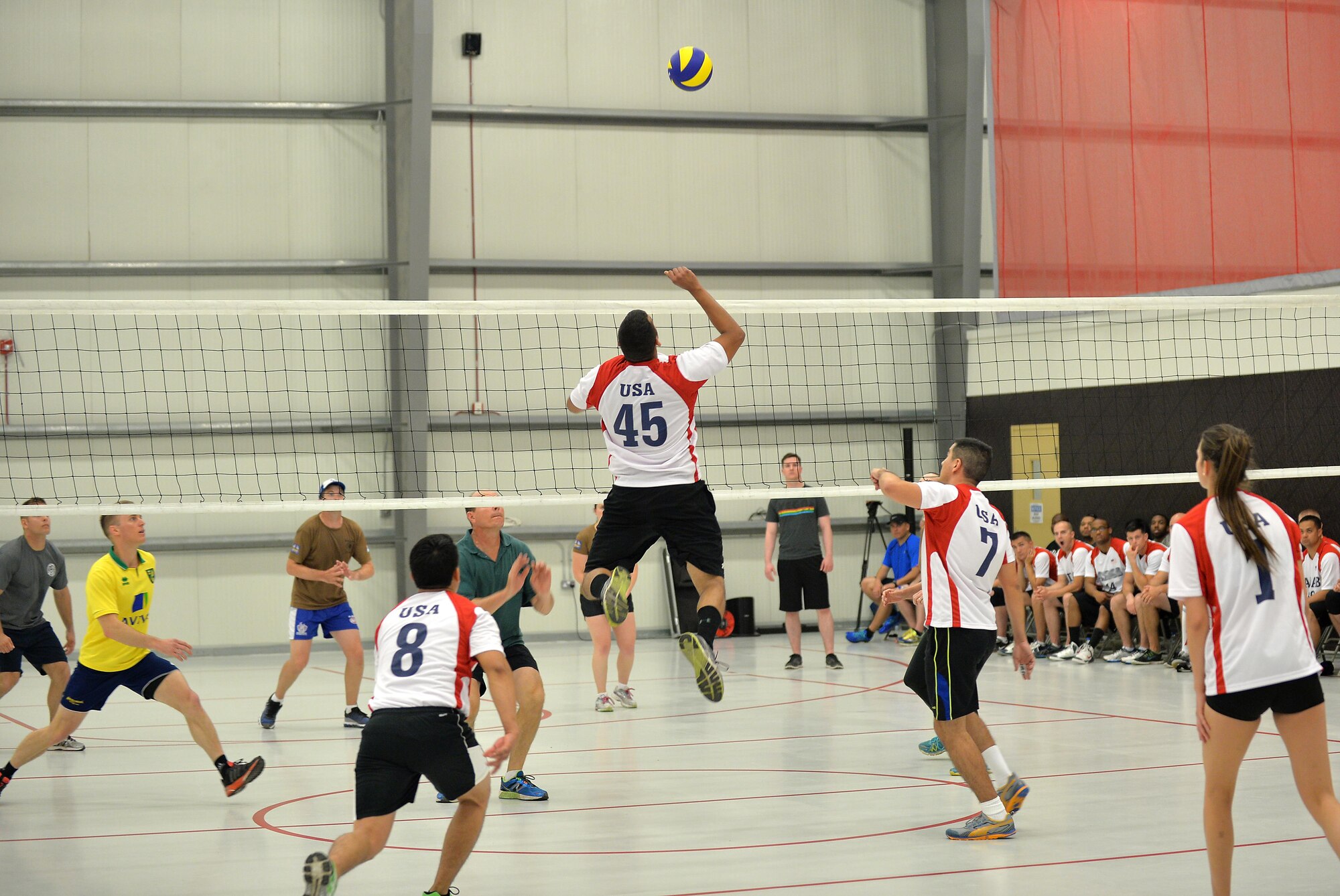 The U.S. plays team Australia in the opening volleyball match of the Friendship Games at an undisclosed location in Southwest Asia May 27, 2015. The tri-sport event is held every two months. In this installment of the games, teams went head-to-head in a 5K run, volleyball and tug-o-war. (U.S. Air Force photo/ Tech. Sgt. Jeff Andrejcik)