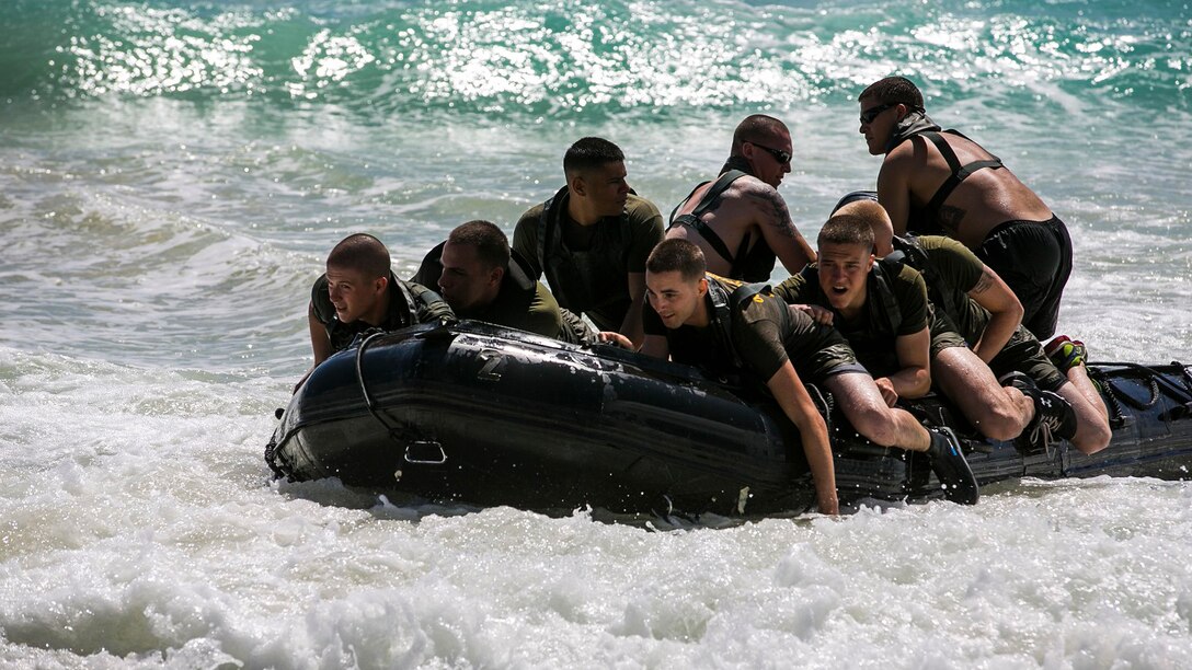 U.S. Marines with the 15th Marine Expeditionary Unit’s Maritime Raid Force ride a combat rubber raiding craft ashore aboard Bellows Air Force Station, Hawaii, May 15, 2015. The 15th MEU’s Force Reconnaissance Detachment helped familiarize the security element Marines with surf passage, broaching and casting procedures. (U.S. Marine Corps photo by Cpl. Anna Albrecht/Released)