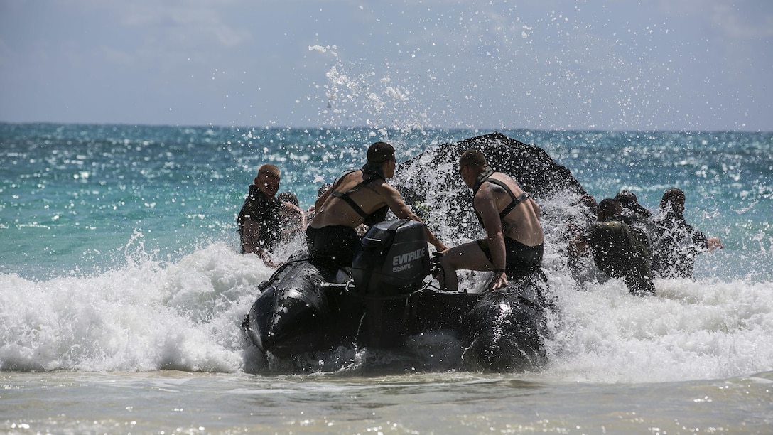 U.S. Marines with the 15th Marine Expeditionary Unit’s Maritime Raid Force practice surf passage procedures aboard Bellows Air Force Station, Hawaii, May 15, 2015. Combat rubber raiding craft give the MRF the ability to quickly and effectively insert onto an objective from the ship to the shore. (U.S. Marine Corps photo by Cpl. Anna Albrecht/Released)