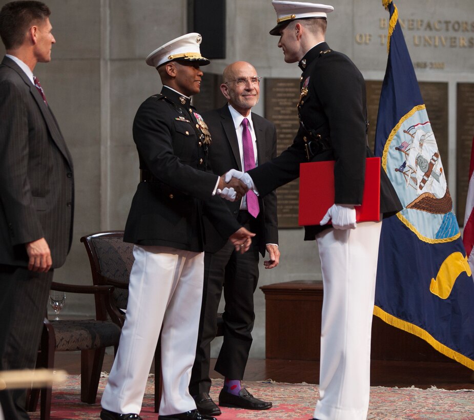 2nd Lt. Patrick Poorbaugh is congratulated by Brig. Gen. Terry Williams, center, Juan Garcia, right, and Peter Awn during his commissioning ceremony at the Low Memorial Library Rotunda, Columbia University, New York May, 21. Poorbaugh became the first Marine in 40 years to commission from the school. Poorbaugh is a Mackinaw, Ill., native, and graduated with a degree in Political Science from the College of General Studies. Williams administered the oath of office and is the Eastern Recruiting Region and Marine Corps Recruit Depot Parris Island commanding general. Garcia is the Assistant Secretary of The Navy. Awn is the Columbia University School of General Studies Dean.