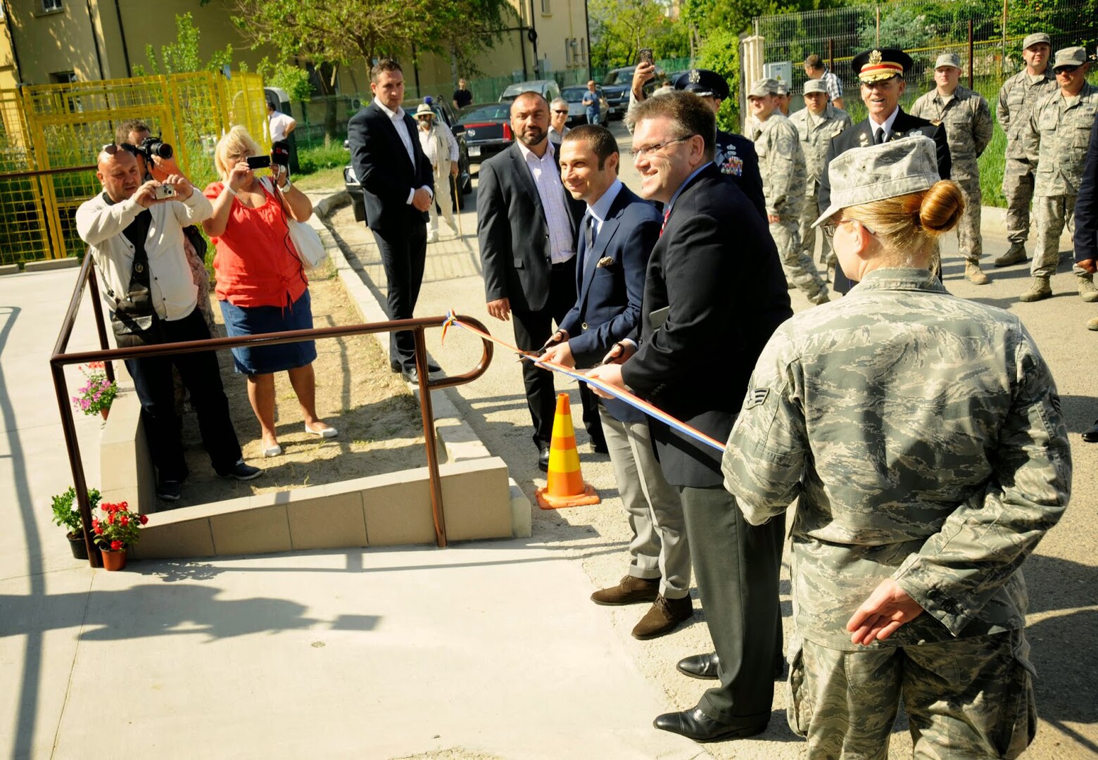 State Department official Dean Thompson, along with mayor of Mangalia, Romania, Radu Cristian, cut the ribbon to the renovated Pavilion C of the Mangalia City Hospital, Romania, May 20, 2015, as part of the U.S. European Command’s (EUCOM) Humanitarian Civic Assistance Program (HCA). The EUCOM HCA program is designed to improve the host nation's critical infrastructure and the underlying living conditions of the civilian populace.