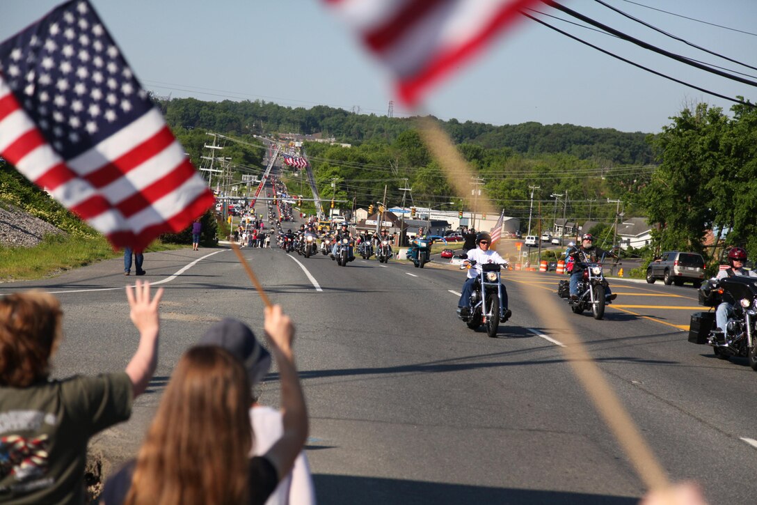 Sunday morning was bright and beautiful as several thousand motorcyclists roared out of the parking lots at the National Museum of the Marine Corps and Quantico Harley-Davidson and headed north toward Washington, D.C., to participate in the 27th annual Rolling Thunder. Rolling Thunder is an annual motorcycle rally that held during the Memorial Day weekend to call for the government's recognition and protection of Prisoners of War and those Missing in Action. The tribute to American war heroes started in 1988 with 2,500 participants. Now approximately 900,000 participants and spectators are involved with this annual demonstration along the National Mall.