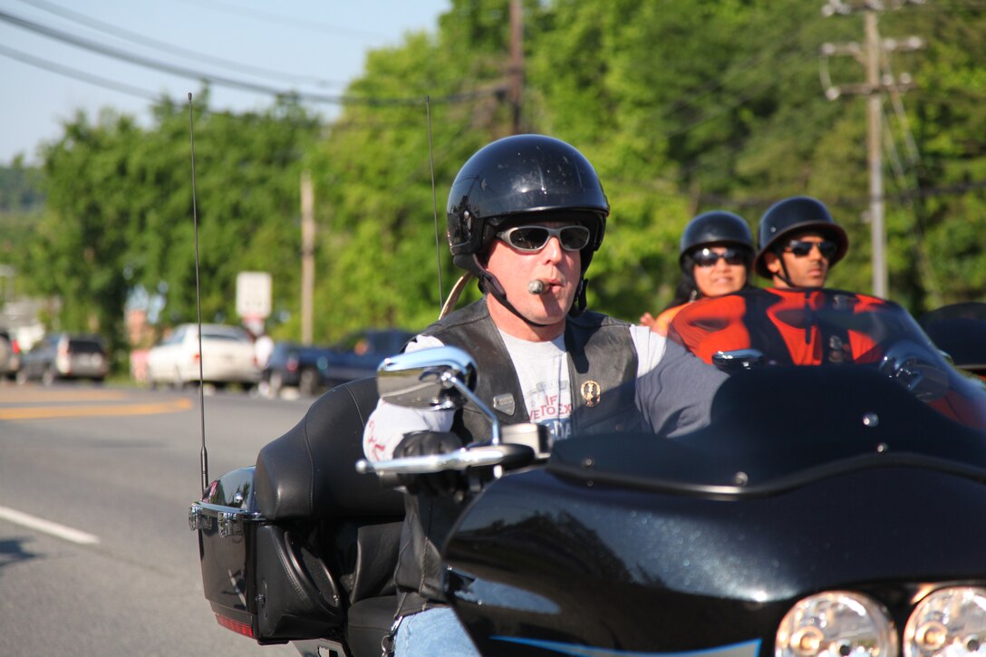 Sunday morning was bright and beautiful as several thousand motorcyclists roared out of the parking lots at the National Museum of the Marine Corps and Quantico Harley-Davidson and headed north toward Washington, D.C., to participate in the 27th annual Rolling Thunder. Rolling Thunder is an annual motorcycle rally that held during the Memorial Day weekend to call for the government's recognition and protection of Prisoners of War and those Missing in Action. The tribute to American war heroes started in 1988 with 2,500 participants. Now approximately 900,000 participants and spectators are involved with this annual demonstration along the National Mall.