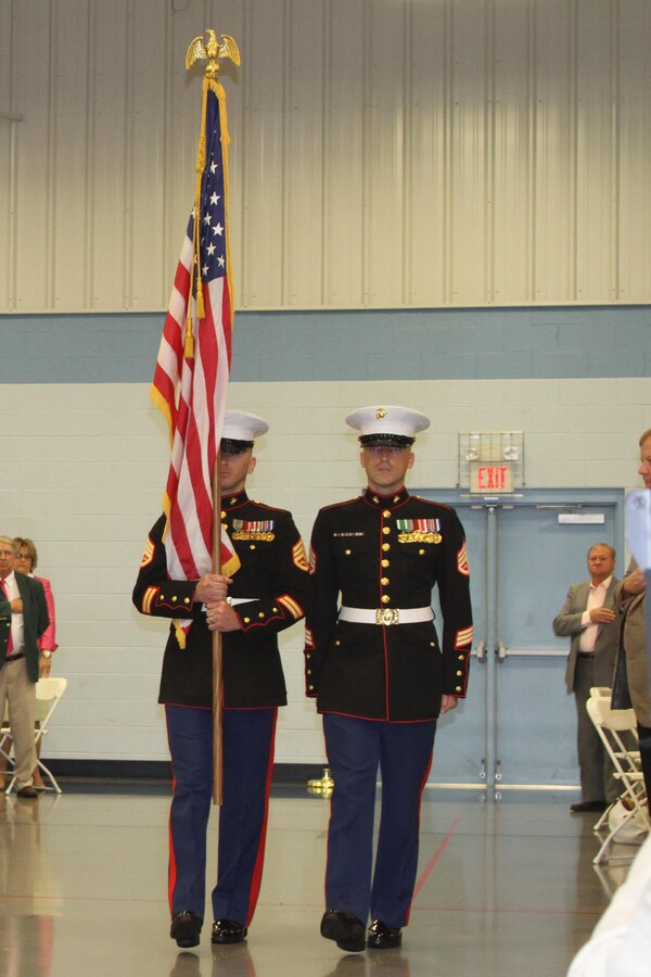 U.S. Marine Corps Staff Sgts. Norman L. Burris, left, a native of Roswell, New Mexico and Daniel A. Wright, a native of Clear Spring, Maryland, recruiters for Recruiting Sub-station Winchester, march with the American flag May 1, 2015 as part of the opening ceremony for the 88th Shenandoah Apple Blossom Prayer Brunch in Winchester, Virginia. The brunch is an official event of the Apple Blossom Festival. The Marines have supported this community’s event for more than 10 years. (U.S. Marine Corps photo by Sgt. Anthony Kirby/Released)