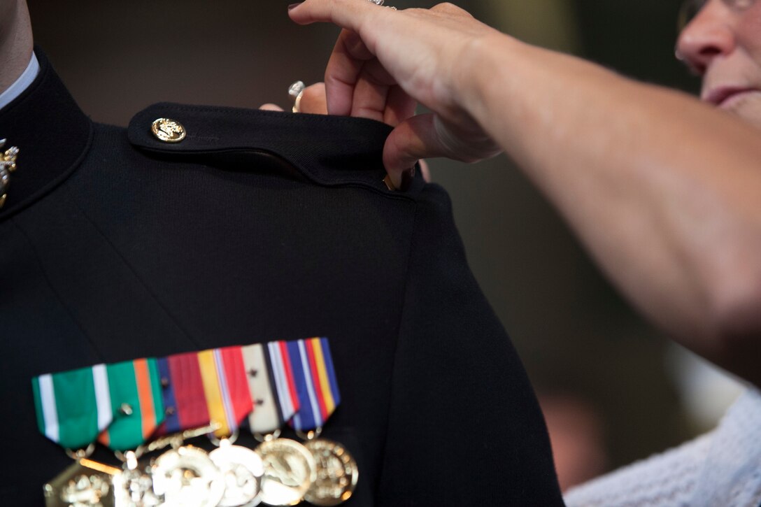 2nd Lt. Patrick Poorbaugh is pinned to his new rank of second lieutenant by his mother, Kim Grierson, during a commissioning ceremony at the Low Memorial Library Rotunda, Columbia University, New York City, May, 21. Poorbaugh became the first Marine in 40 years to commission from the school. Poorbaugh is a Mackinaw, Ill., native, and graduated with a degree in Political Science from the College of General Studies.