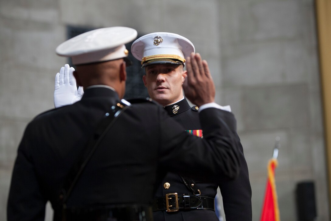 Brig. Gen. Terry Williams administers the oath of office to Staff Sgt. Patrick Poorbaugh during his commissioning ceremony in the Low Memorial Library Rotunda, Columbia University, New York May, 21. Poorbaugh became the first Marine in 40 years to commission from the school. Poorbaugh is a Mackinaw, Illinois, native, and graduated with a degree in Political Science from the College of General Studies. Williams is commanding general of Eastern Recruiting Region and Marine Corps Recruit Depot Parris Island.