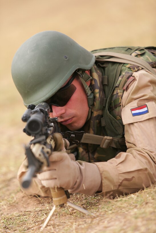 A Dutch soldier provides security during a distinguished visitor day May 20 in the Tifnit, Morocco training area. The DV day was designed to allow observation of what had been accomplished during the week-long training at the camp as a part of Exercise African Lion 2015. Exercise African Lion 15 is an annually-scheduled, combined U.S.–Moroccan exercise designed to improve mutual understanding of each nation’s tactics, techniques and procedures while demonstrating the strong bond between the two nation’s militaries.  The one-week exercise includes various types of military training, including a command post exercise; stability operations, such as nonlethal weapons training and crisis/disaster response training.  Additionally, in February an intelligence capacity building seminar was conducted.