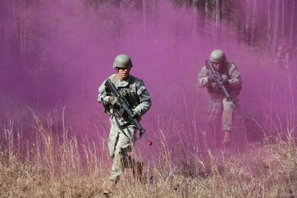 Sgt. John Nuzzela, a cavalry scout from Fort Hood, navigates through the smoke during the field leadership training exercise of the course he recently completed