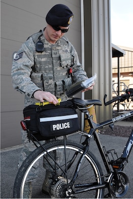 Air Force Reserve Staff Sgt. Adam Tyjeski, a security response team member assigned to the 910th Security Forces Squadron, shows the features of his patrol bike here, May 2, 2015. Tyjeski is among several squadron members qualified to perform this specialized duty as bike patrolmen and has been part of the patrol for two years. (U.S. Air Force photo/Tech. Sgt. James Brock)
