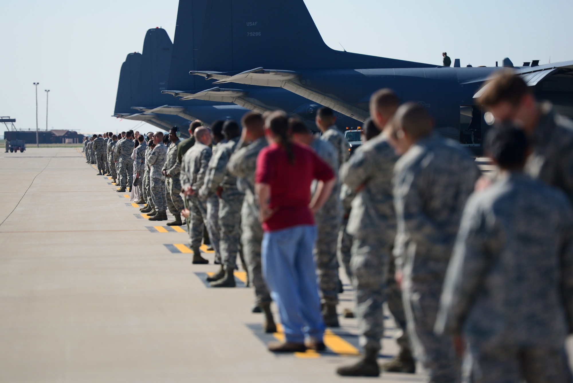 Hundreds of Air Commandos lined up down the flightline to witness the final take-off of the AC-130H Spectre gunship, nicknamed “Excalibur”, May 27, 2015 at Cannon Air Force Base, N.M. Over the last two years, Air Commandos within the 16th Special Operations Squadron have bid farewell to the entire fleet of this historic aerial asset, as each of the eight aircraft have been one-by-one ceremoniously retired after 46 years of dedicated service. (U.S. Air Force photo/Senior Airman Eboni Reece)