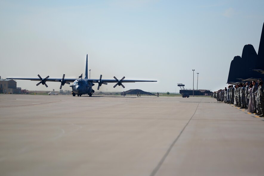 Spectators watch as AC-130H Spectre gunship, nicknamed “Excalibur”, taxis down the flightline for its final time, May 27, 2015 at Cannon Air Force Base, N.M. Over the last two years, Air Commandos within the 16th Special Operations Squadron have bid farewell to the entire fleet of this historic aerial asset, as each of the eight aircraft have been one-by-one ceremoniously retired after 46 years of dedicated service. (U.S. Air Force photo/Senior Airman Eboni Reece)