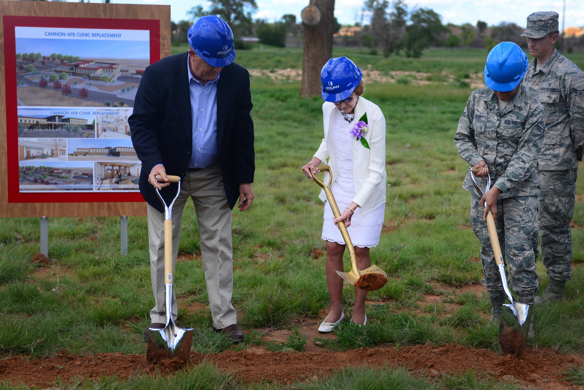 Meredith Bender, participant in groundbreaking, turns the dirt at the medical clinic groundbreaking ceremony, May 26, 2015 at Cannon Air Force Base, N.M. Bender was present in November of 1965 and participated in the original groundbreaking ceremony for the 832nd Tactical Hospital. (U.S. Air Force photo/ Senior Airman Eboni Reece)