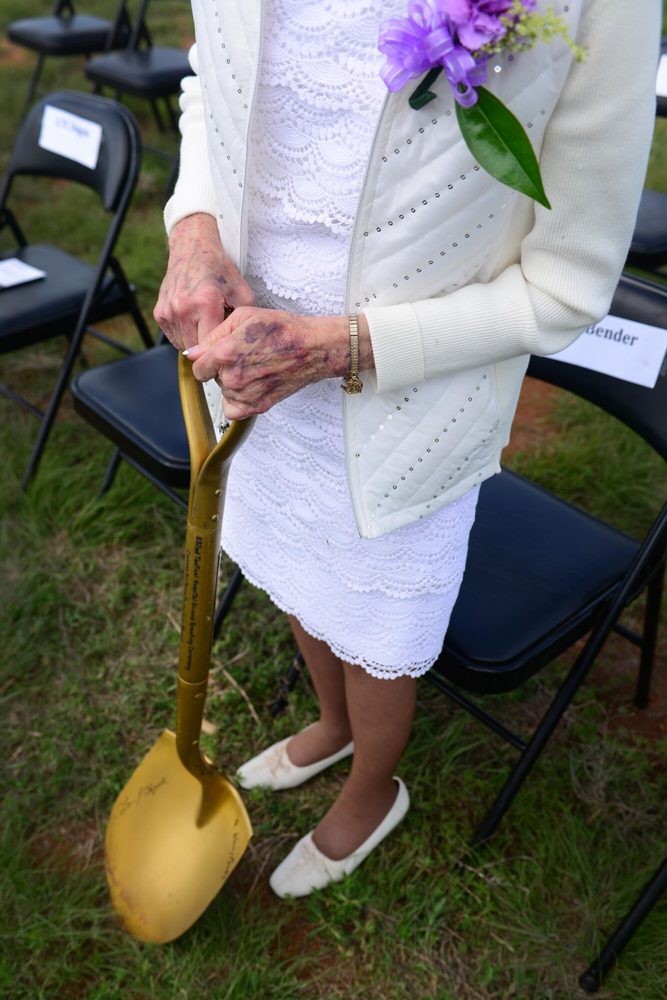 Meredith Bender, participant in the day’s groundbreaking, stands with the same shovel used in the original 1965 groundbreaking ceremony, May 26, 2015 at Cannon Air Force Base, N.M. Benders retired after 42 years of service with the 27th Special Operations Medical Group. (U.S. Air Force photo/ Senior Airman Eboni Reece) 