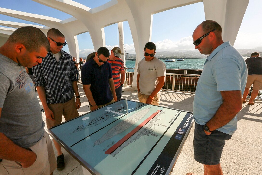 U.S. Marines with India Company, Battalion Landing Team 3rd Battalion, 1st Marine Regiment, 15th Marine Expeditionary Unit, visit the USS Arizona Memorial at Pearl Harbor in Honolulu, Hawaii, May 19, 2015. The Marines of BLT 3/1 took a moment to remember their predecessors in honor of Memorial Day. (U.S. Marine Corps photo by Sgt. Jamean Berry/Released)