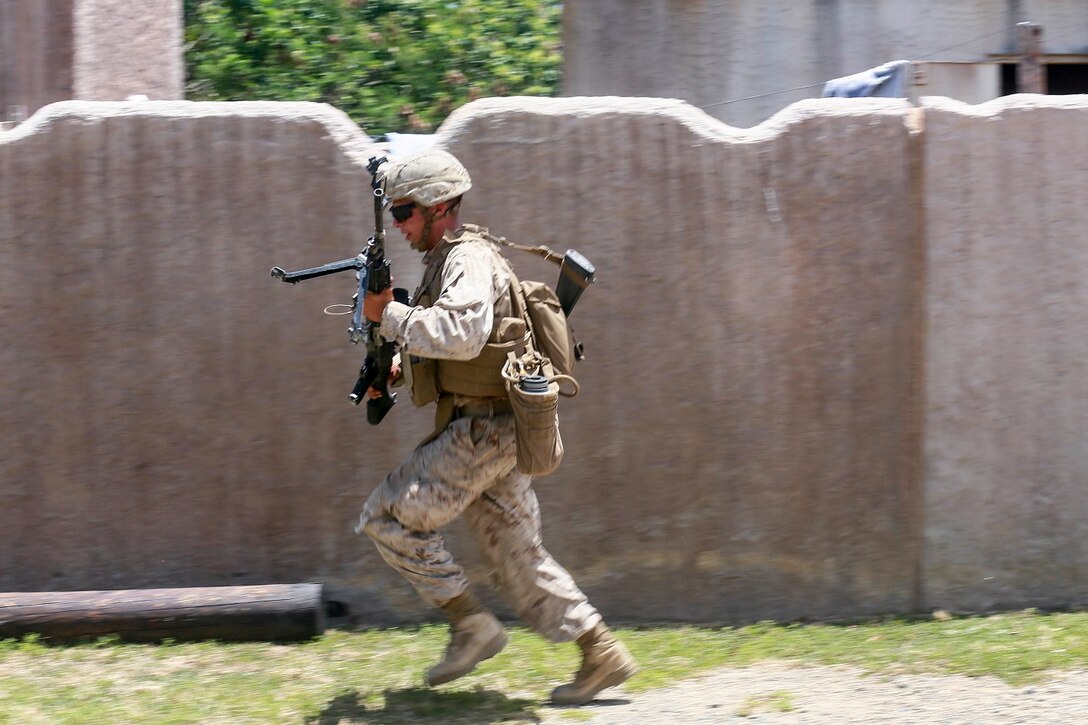 A U.S. Marine with India Company, Battalion Landing Team 3rd Battalion, 1st Marine Regiment, 15th Marine Expeditionary Unit, sprints to cover aboard Bellows Air Force Station, Hawaii, May 16, 2015. The Marines of BLT 3/1 used Hawaii’s unique environment and training areas to prepare for possible scenarios in their upcoming deployment. (U.S. Marine Corps photo by Sgt. Jamean Berry/Released)