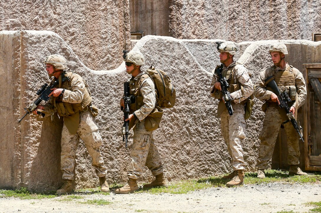 U.S. Marines with India Company, Battalion Landing Team 3rd Battalion, 1st Marine Regiment, 15th Marine Expeditionary Unit, prepare to move to their next position aboard Bellows Air Force Station, Hawaii, May 16, 2015. The Marines of BLT 3/1 used Hawaii’s unique environment and training areas to prepare for possible scenarios in their upcoming deployment. (U.S. Marine Corps photo by Sgt. Jamean Berry/Released)