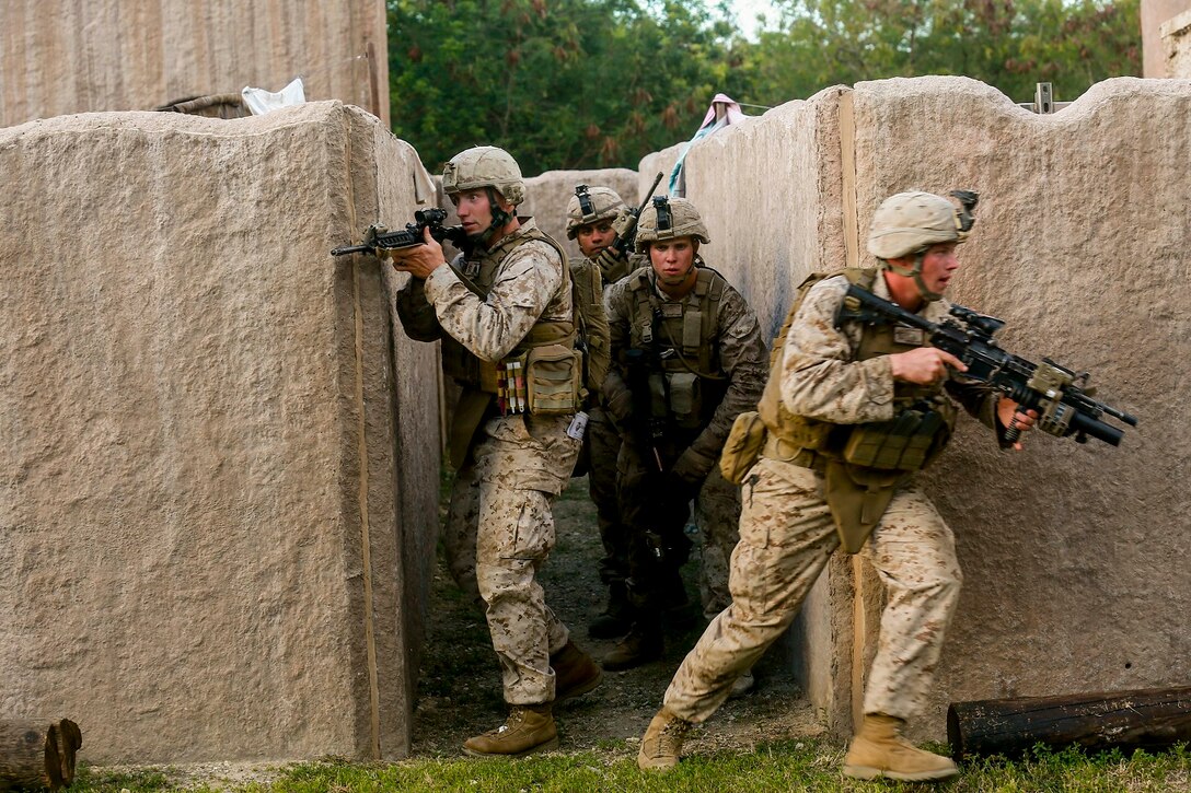 U.S. Marines with India Company, Battalion Landing Team 3rd Battalion, 1st Marine Regiment, 15th Marine Expeditionary Unit, clear an alley aboard Bellows Air Force Station, Hawaii, May 16, 2015. The Marines of BLT 3/1 used Hawaii’s unique environment and training areas to prepare for possible scenarios in their upcoming deployment. (U.S. Marine Corps photo by Sgt. Jamean Berry/Released)