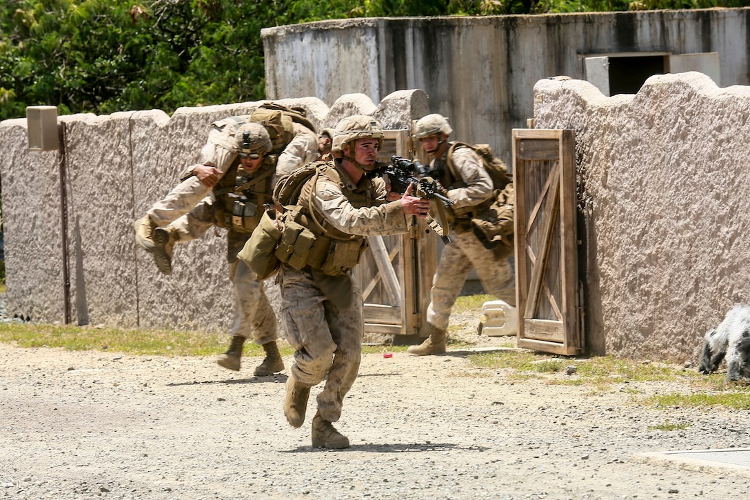 U.S. Marines with India Company, Battalion Landing Team 3rd Battalion, 1st Marine Regiment, 15th Marine Expeditionary Unit, move a simulated casualty to cover aboard Bellows Air Force Station, Hawaii, May 16, 2015. The Marines of BLT 3/1 used Hawaii’s unique environment and training areas to prepare for possible scenarios in their upcoming deployment. (U.S. Marine Corps photo by Sgt. Jamean Berry/Released)