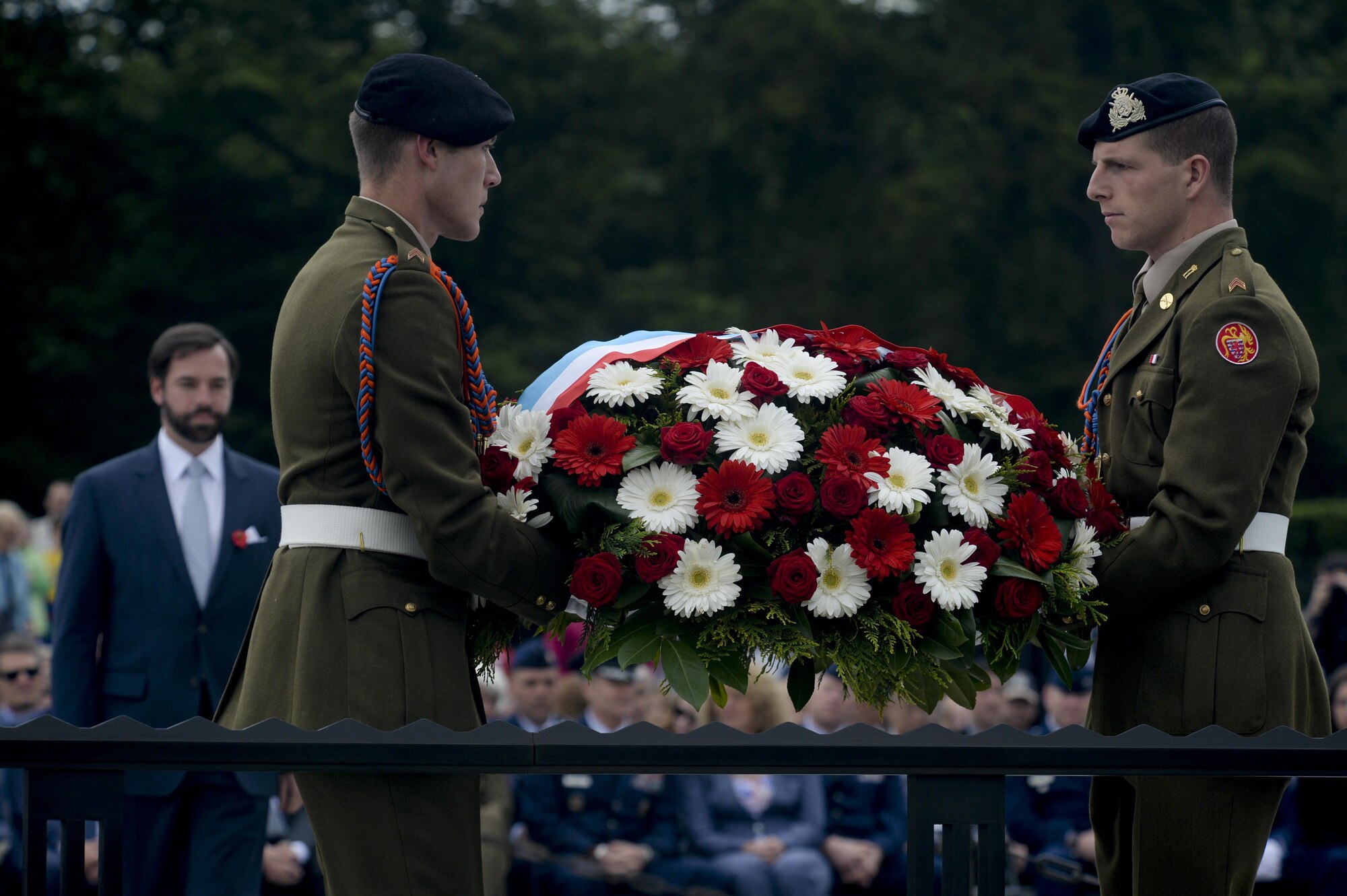 Crown Prince Guillaume of Luxembourg, left, waits to place a wreath carried by two Luxembourg army soldiers during a Memorial Day ceremony at the Luxembourg American Cemetery and Memorial May 23, 2015. More than 300 Luxembourgers and Americans gathered at the cemetery to reflect on the sacrifices made by fallen U.S. service members. (U.S. Air Force photo/Staff Sgt. Joe W. McFadden) 
