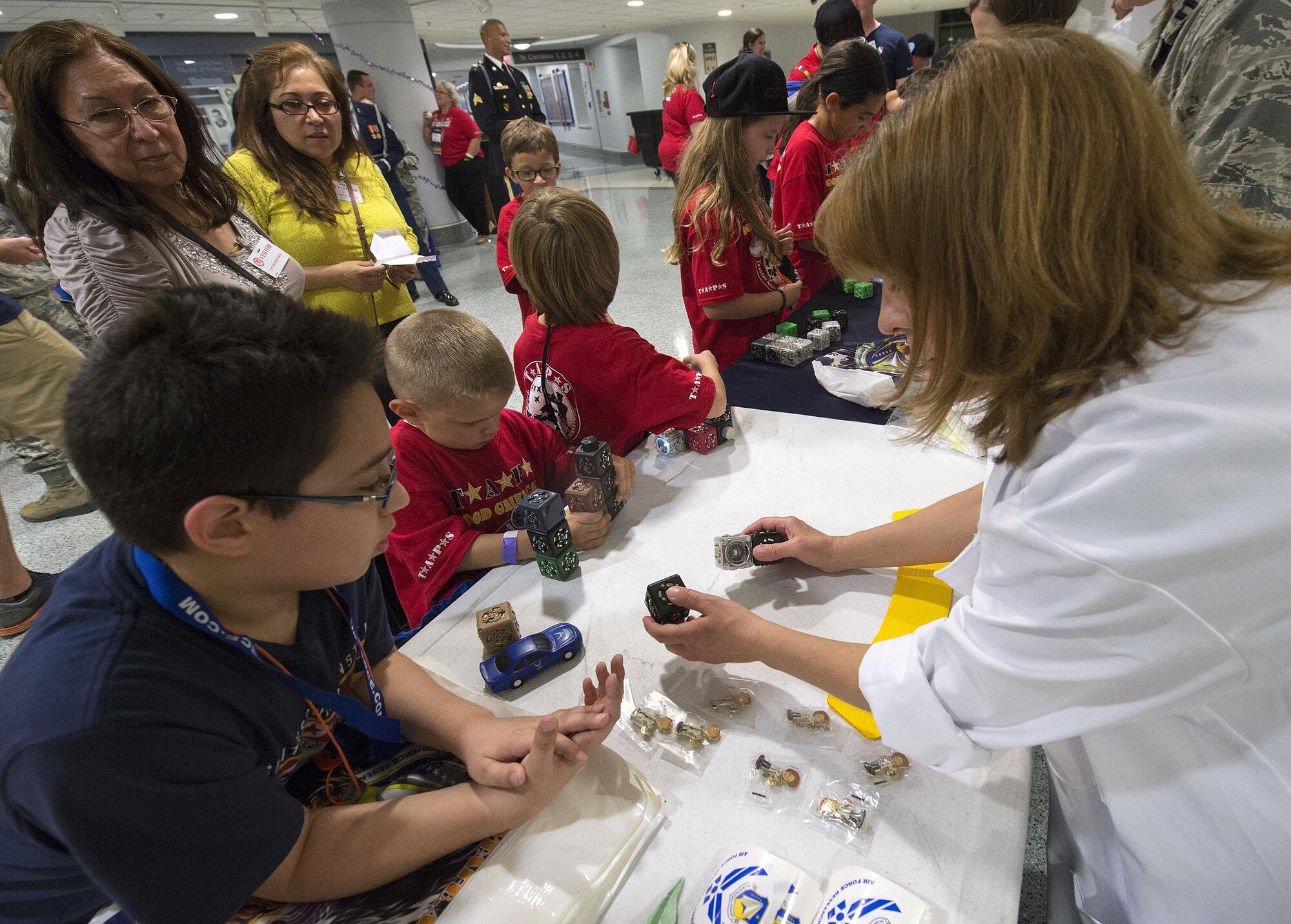 Representatives from the Air Force Research Lab were on hand to demonstrate various scientific principles during a 21st Annual Tragedy Assistance Program for Survivors (TAPS) Military Survivor Seminar and Good Grief Camp for Young Survivors event at the Pentagon in Washington, D.C., May 22, 2015. The TAPS Good Grief Camp for children and teens provides a safe and supportive atmosphere for kids to learn coping skills, establish and identify support systems, and create awareness that they are not alone in their grief. (U.S. Air Force photo/Jim Varhegyi)